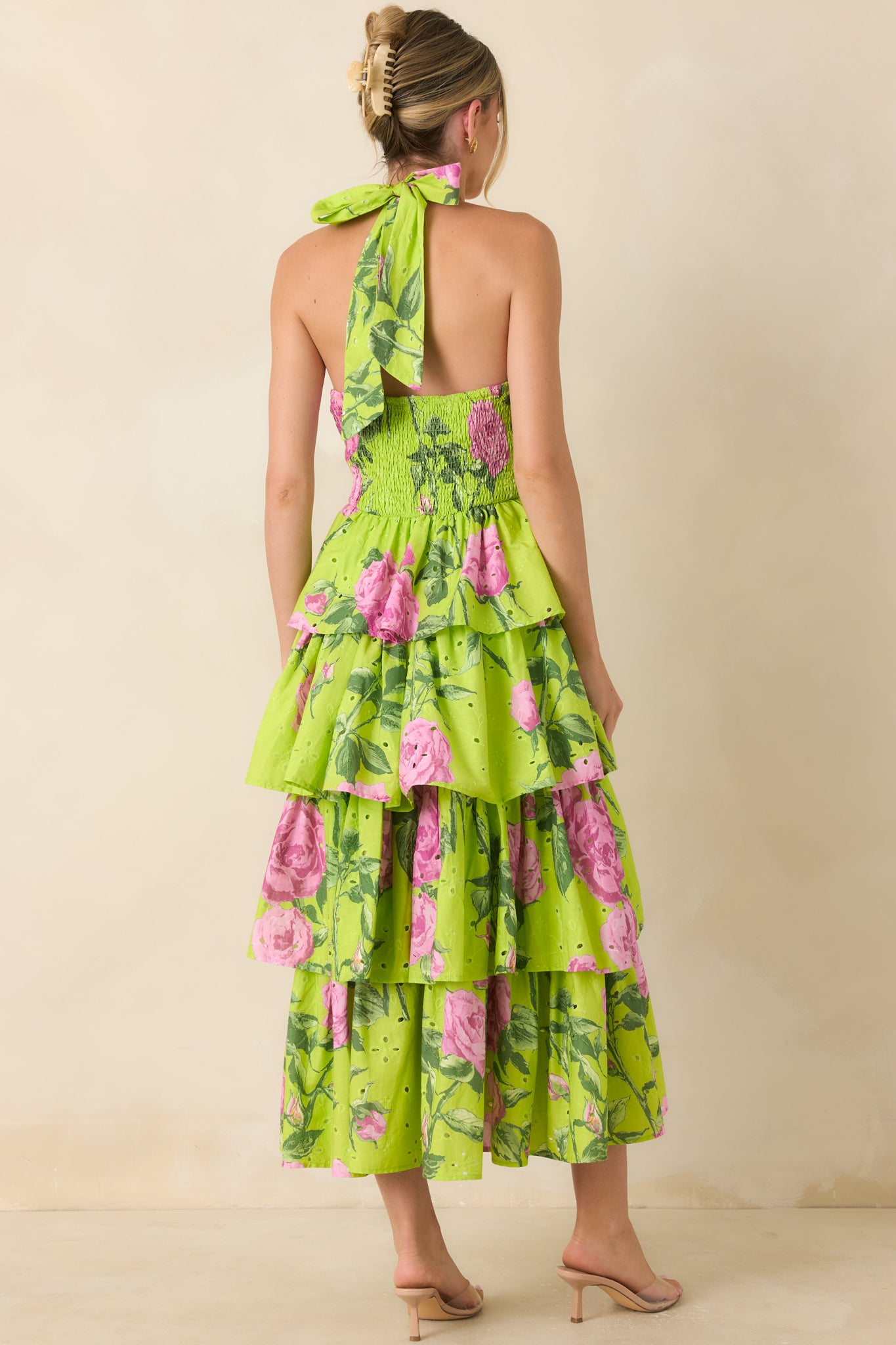 Back view of the eyelet midi dress featuring a smocked back panel and halter tie closure