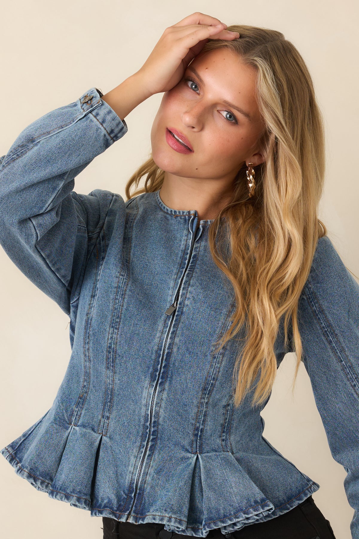 Faded jacket featuring pleated panels extending from the waist.