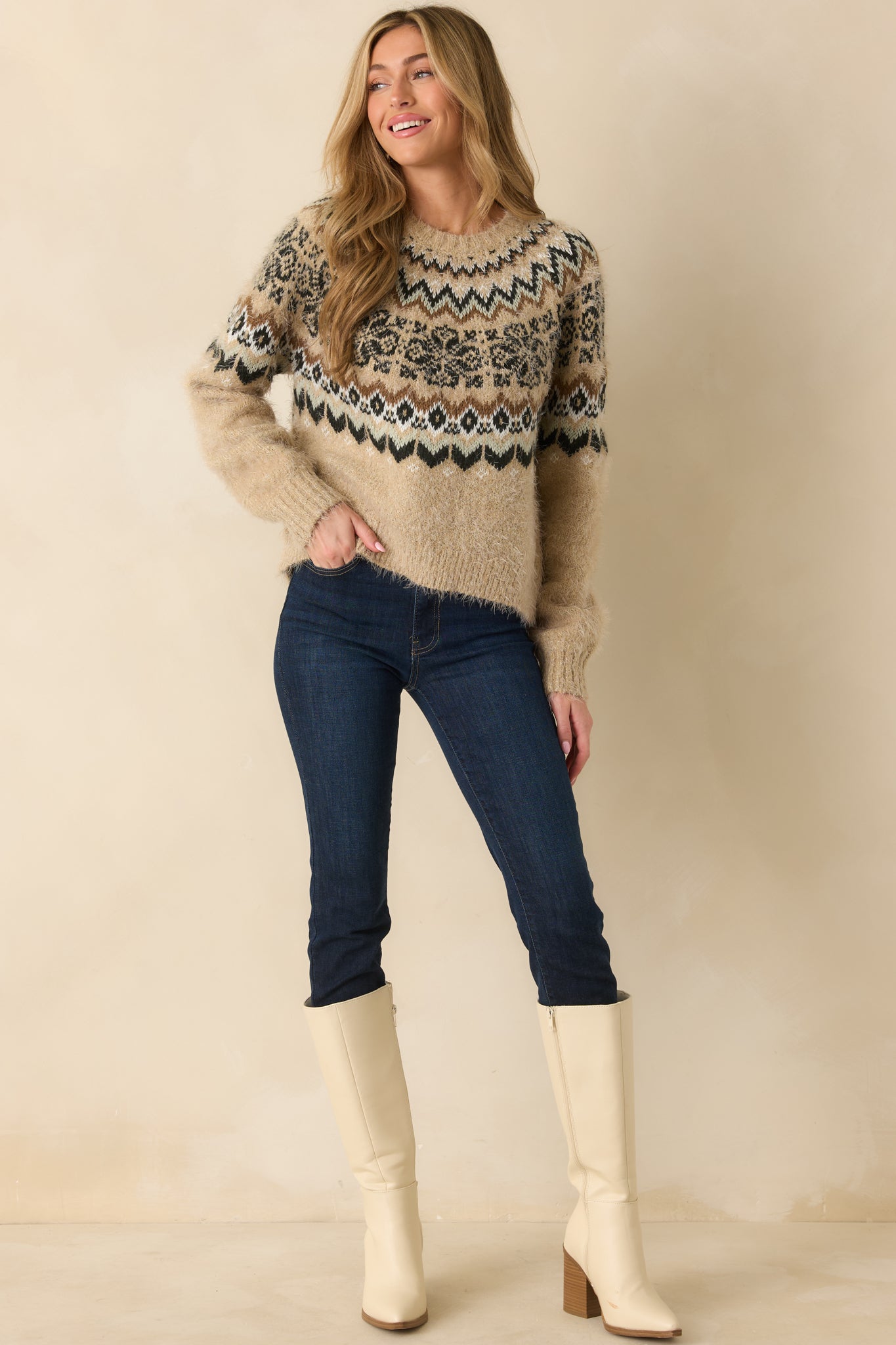 Fair Isle sweater displaying long sleeves with ribbed cuffs and an easy drape.