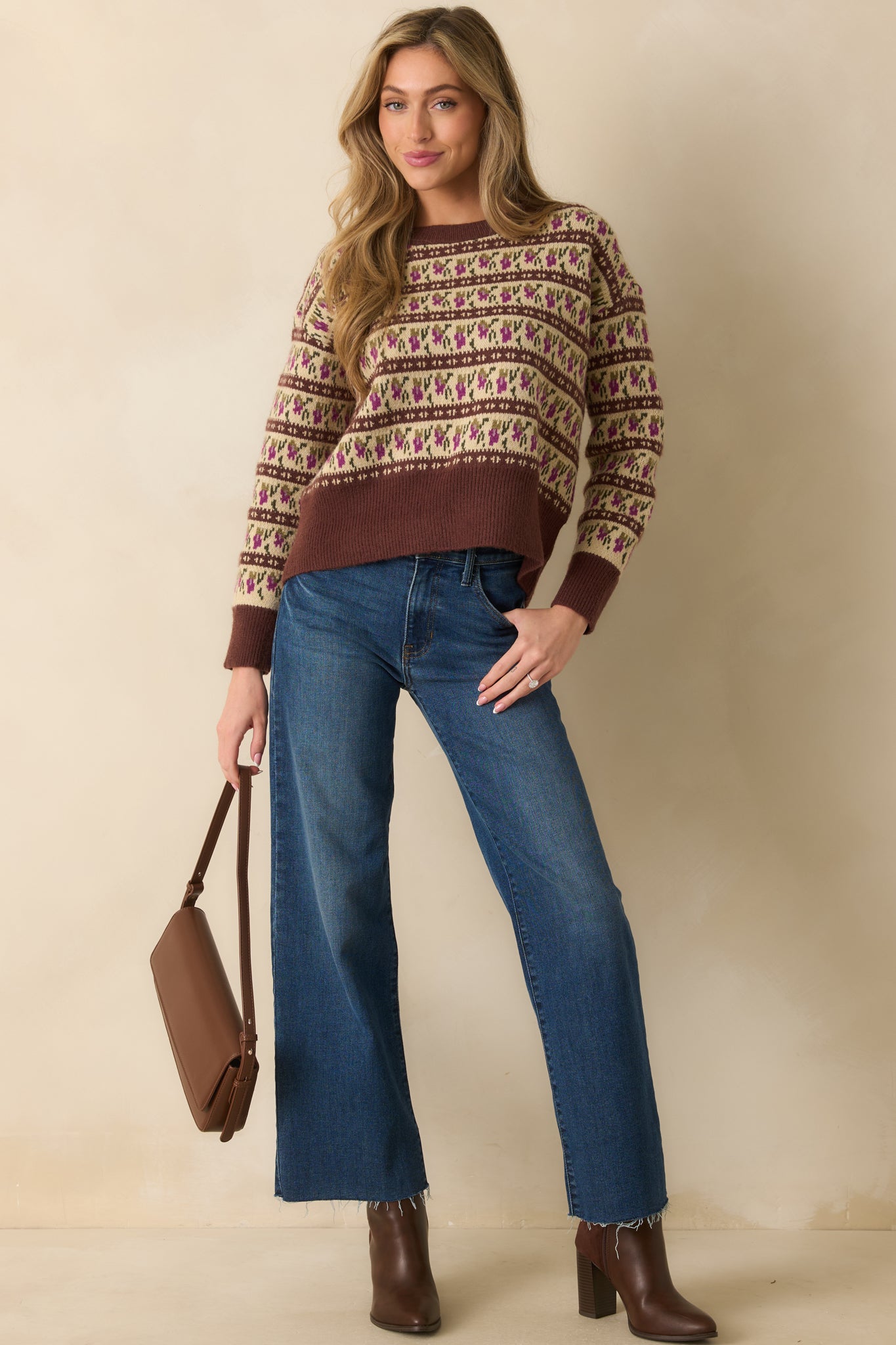 Front-facing Fair Isle sweater showing ribbed cuffs and hem with the patterned knit across the body.