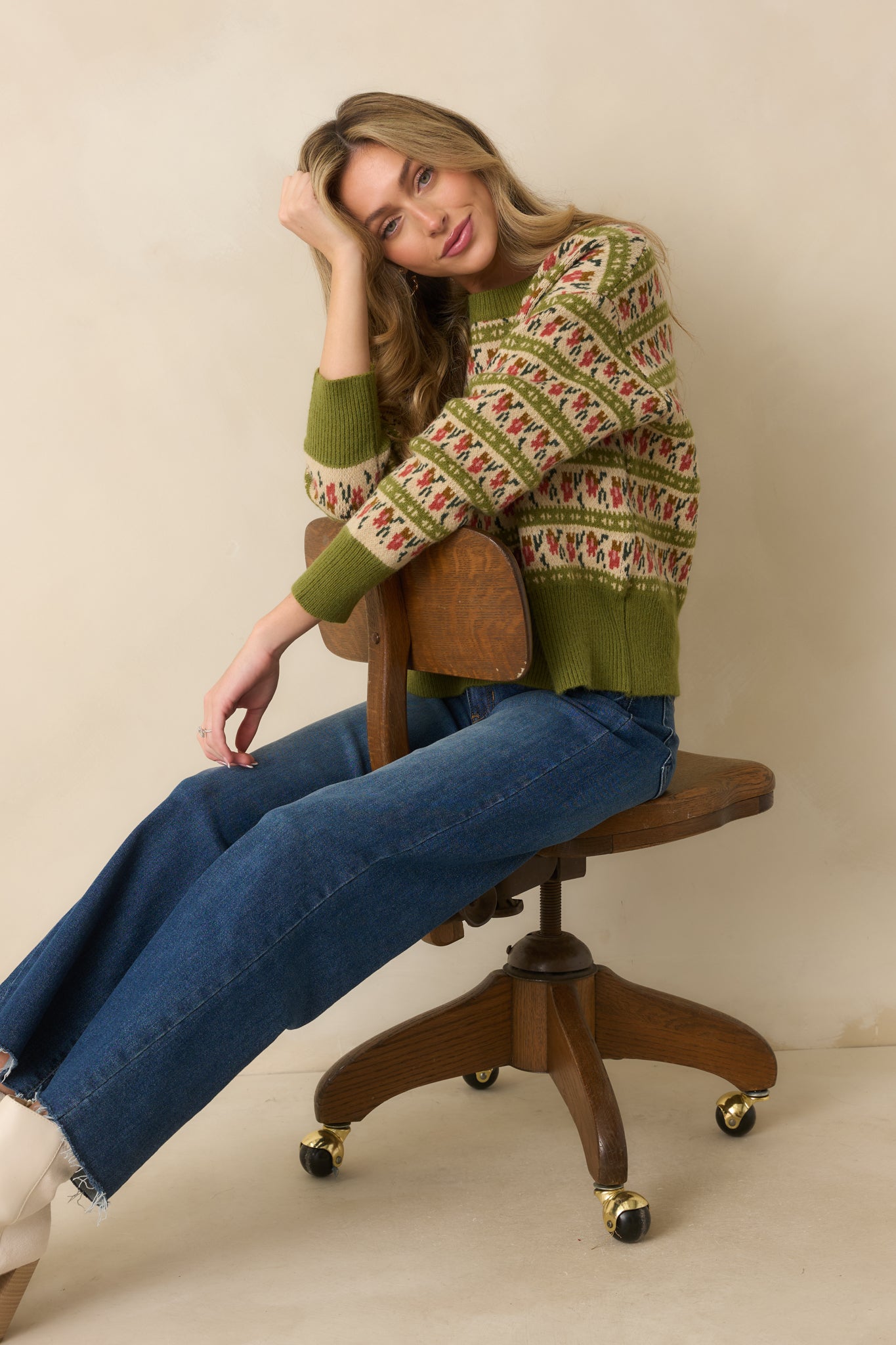 Cozy Fair Isle sweater in light olive green, finished with ribbed cuffs and hem for a snug fit.