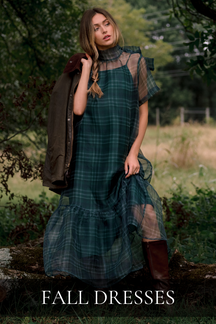Model wearing a green tartan maxi dress. Text reads: "Fall Dresses."
