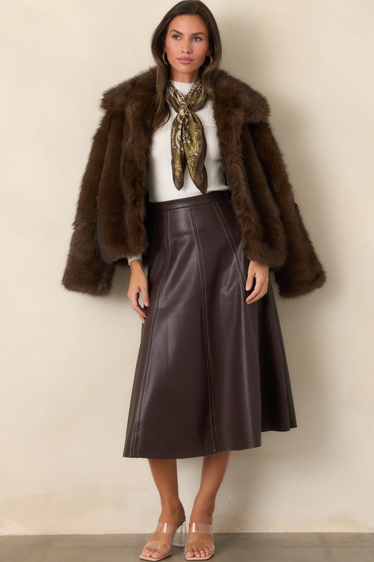 Faux leather A-line skirt showcasing its structured panels, defined waistband, and clean flared shape.