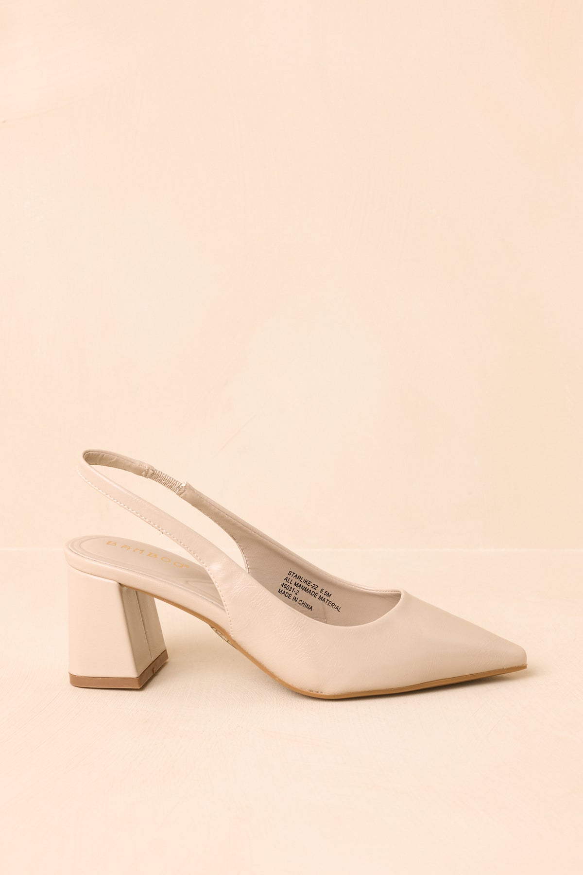 Faux leather pearl heels combine a pointed toe with a wide block heel and secure strap around the back.