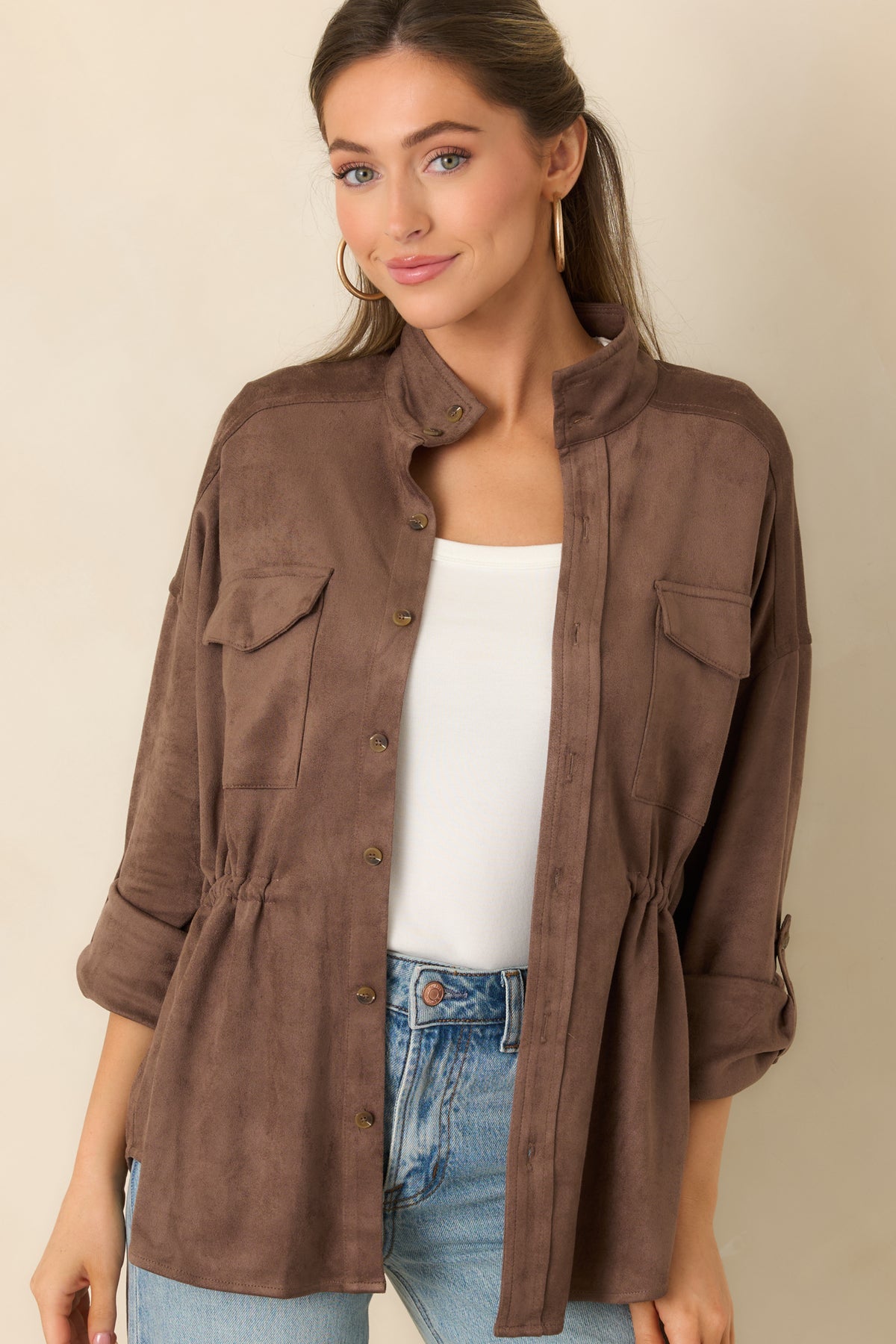 Button-front faux suede jacket with an adjustable interior drawstring for a customizable waist.