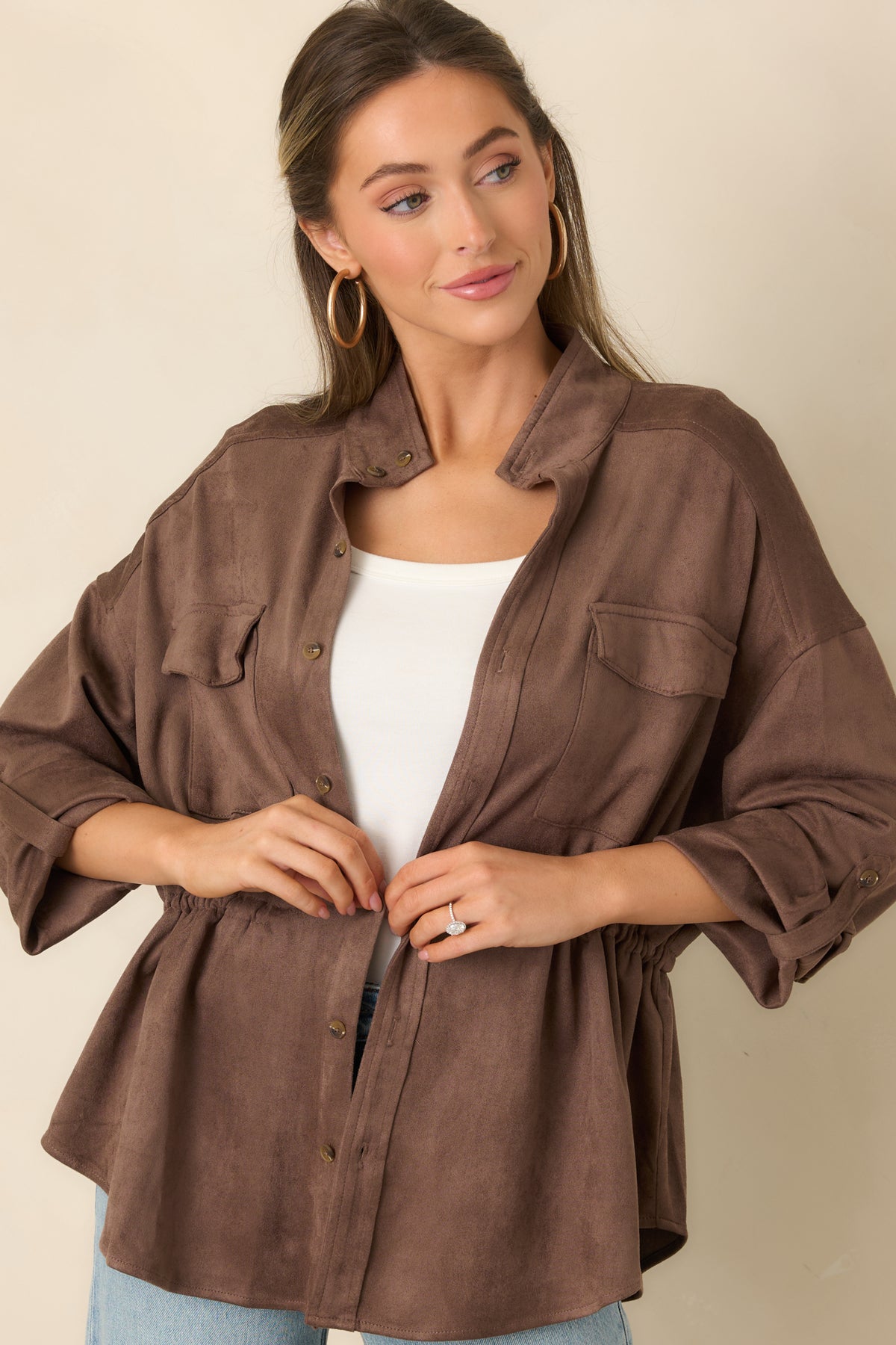 Flap chest pockets add utility-inspired detail to the faux suede jacket.