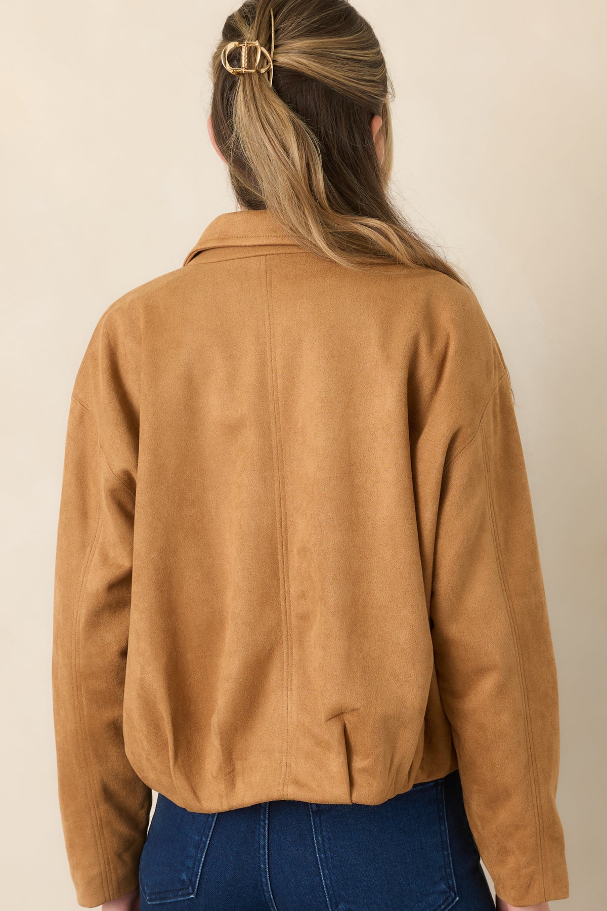 Rear view of the stretch faux suede jacket showcasing the dropped shoulder design, relaxed blouson silhouette, subtle seams, and gathered hem.