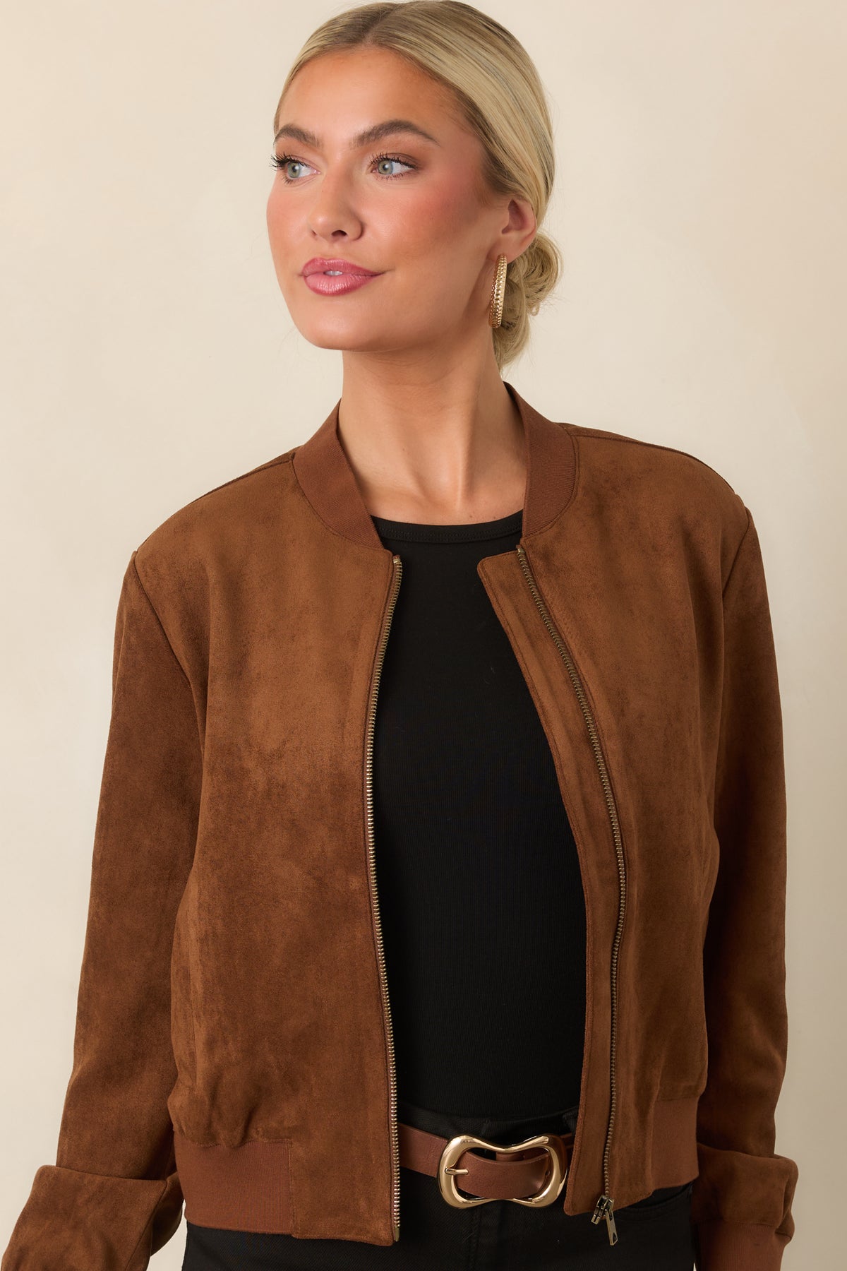Faux suede jacket highlighting the ribbed baseball collar and smooth metal zip-front closure.