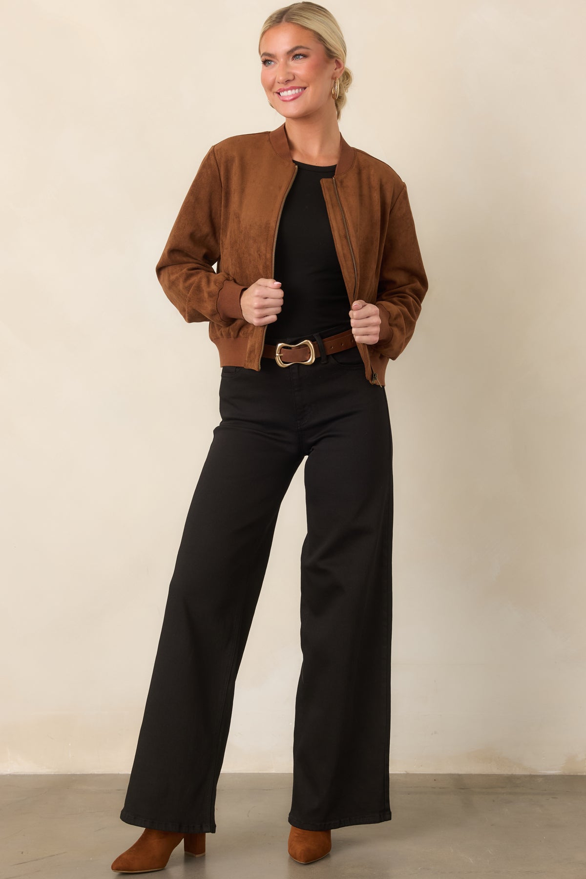 Faux suede jacket with sporty ribbed trim, a relaxed shape, and side welt pockets.