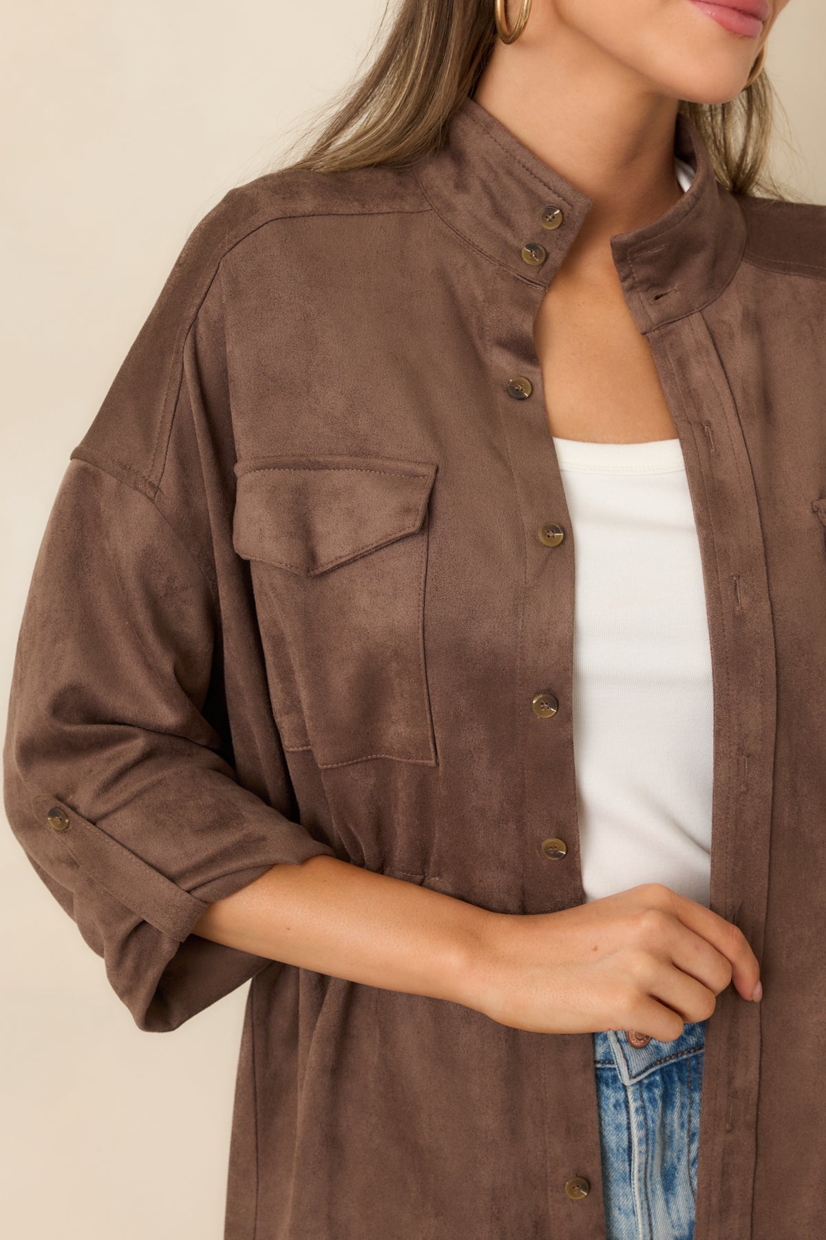 Close-up of the supple faux suede texture and button detailing on the jacket.
