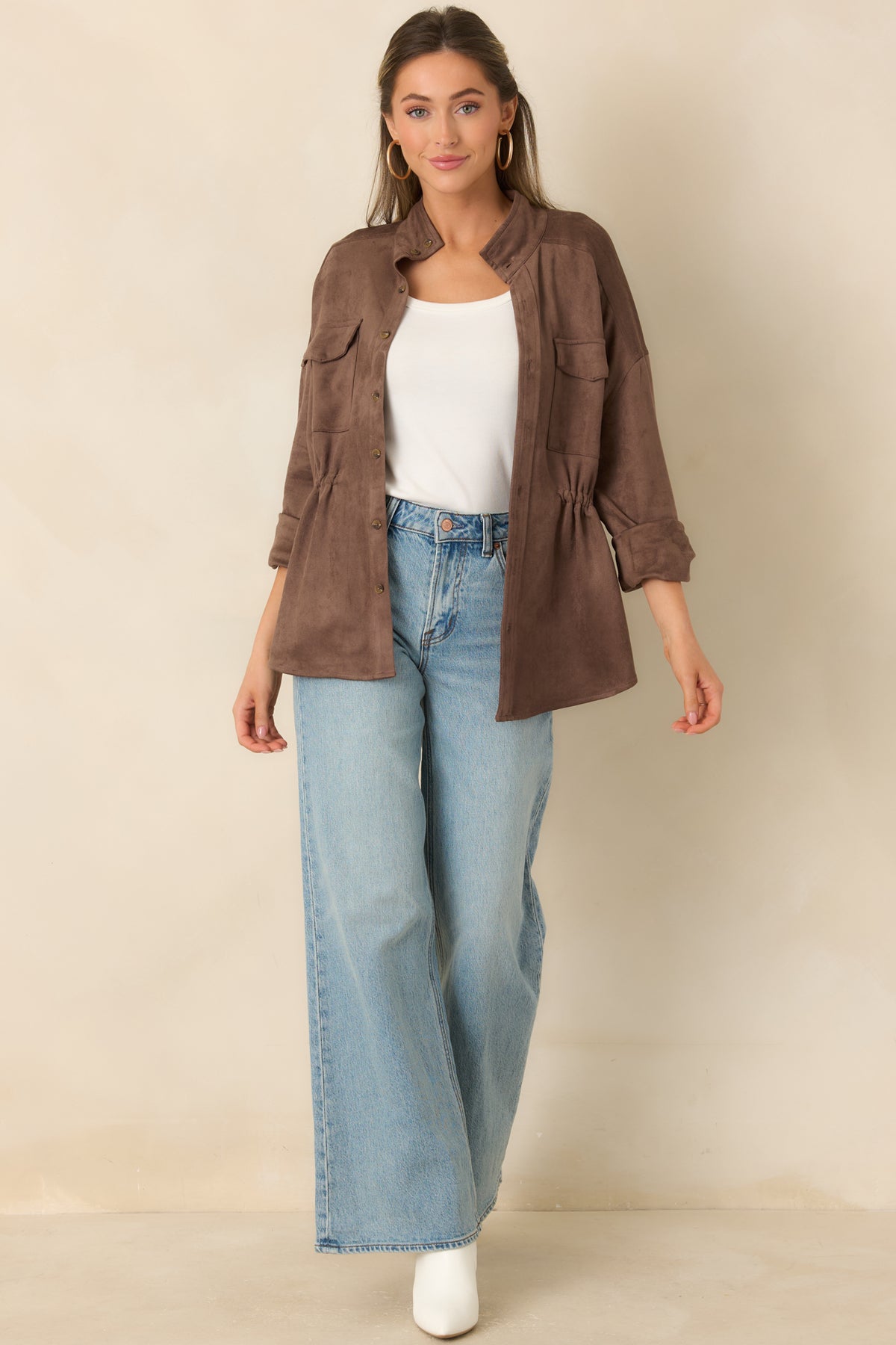 Relaxed faux suede jacket with utility-inspired chest pockets and an adjustable interior drawstring waist.