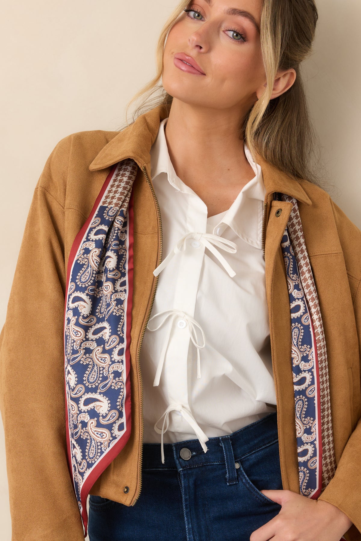 Detailed view of the jacket showing its concealed zip closure, dropped shoulder construction, and subtle seam detailing.