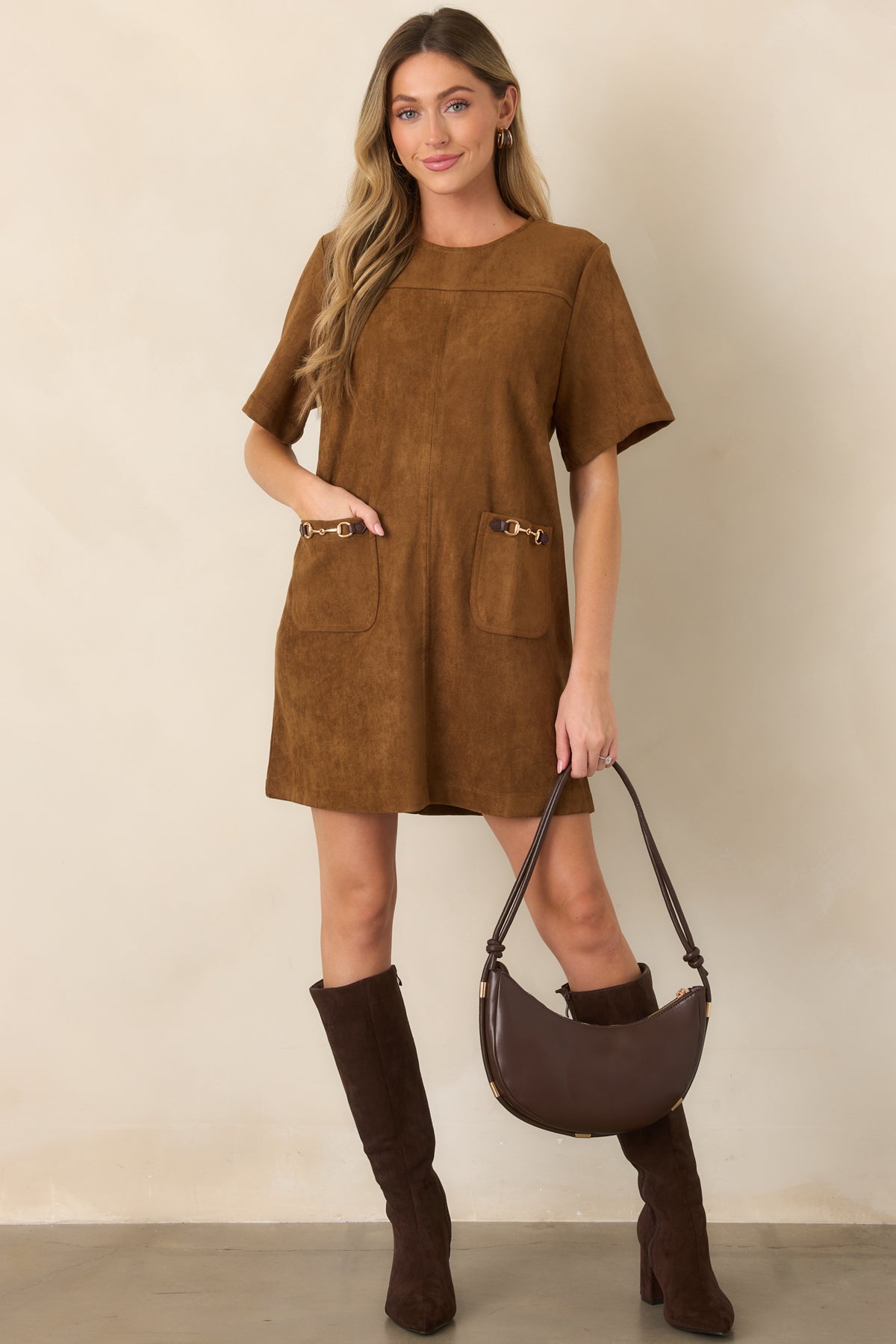 Faux suede mini dress designed with a round neckline, short sleeves, and equestrian-inspired gold-tone horsebit detailing.