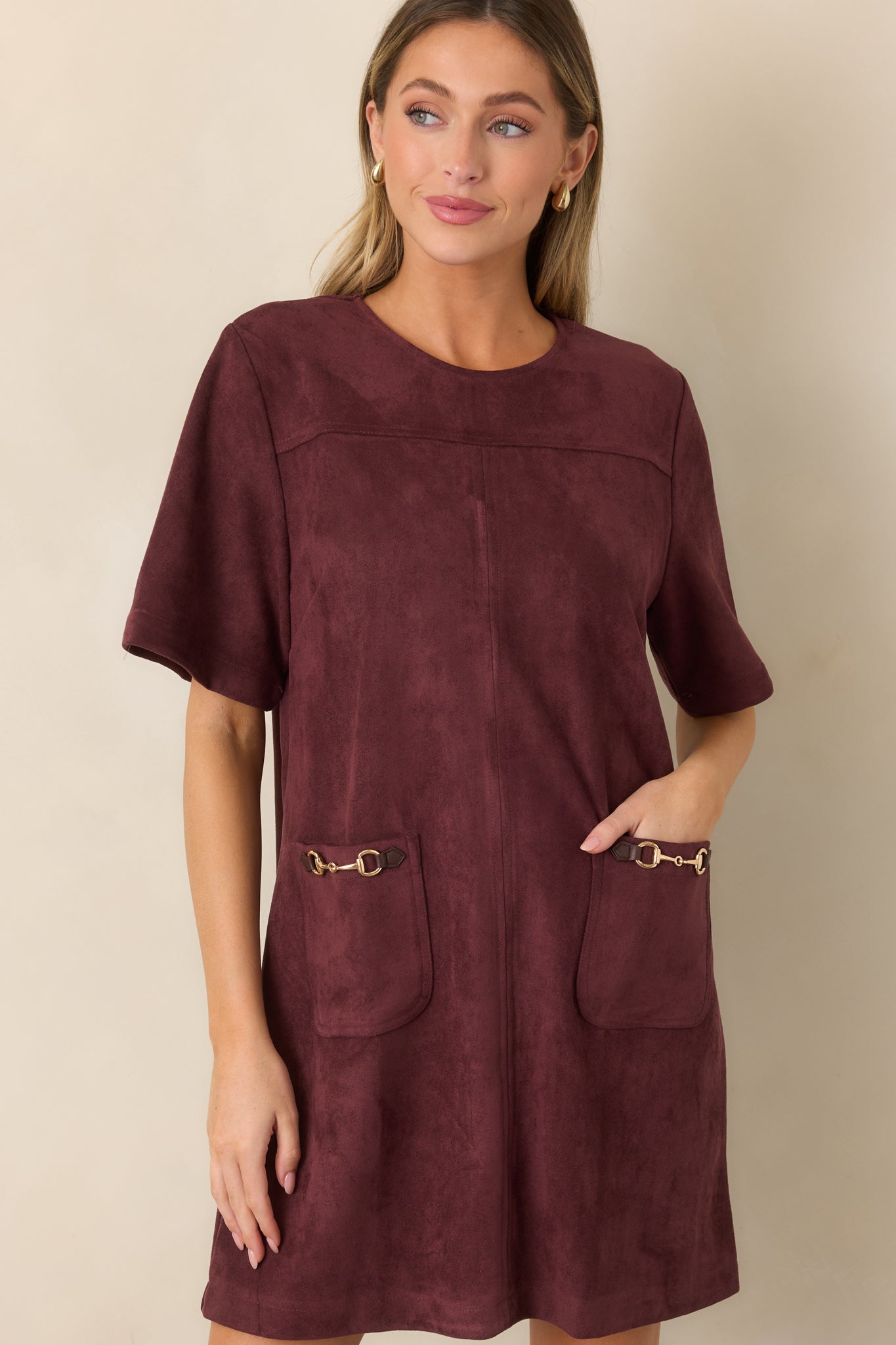 Faux suede dress detail featuring the short sleeve, clean round neckline, and softly textured stretch fabric.