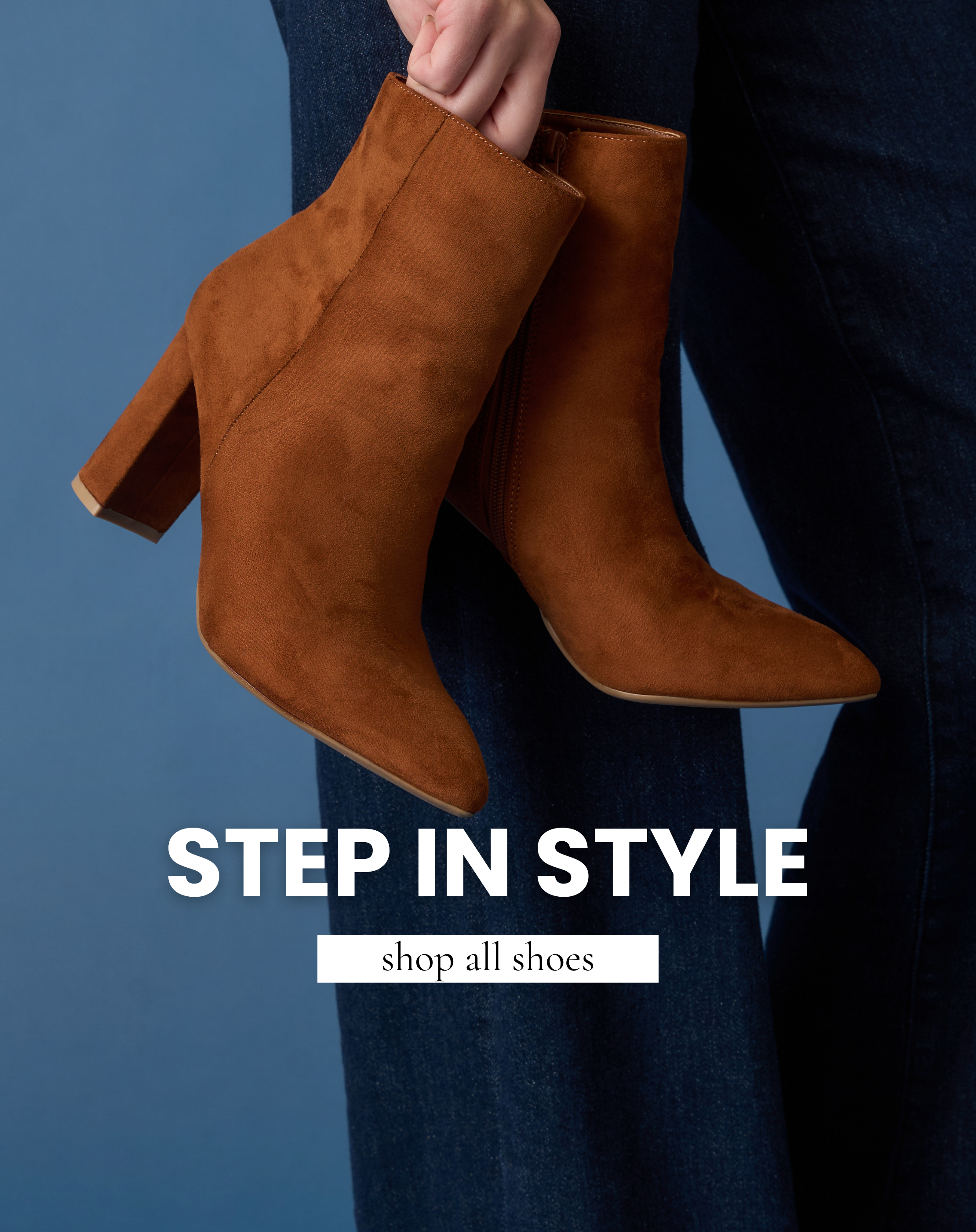 Pair of brown suede ankle boots with block heels shown against dark denim jeans and a blue background. Text reads “Step in Style” and “Shop All Shoes.”