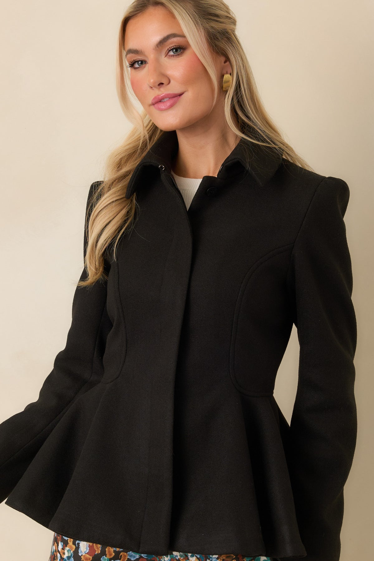 Felt jacket showcasing the curved seam detailing that shapes the fitted bodice.
