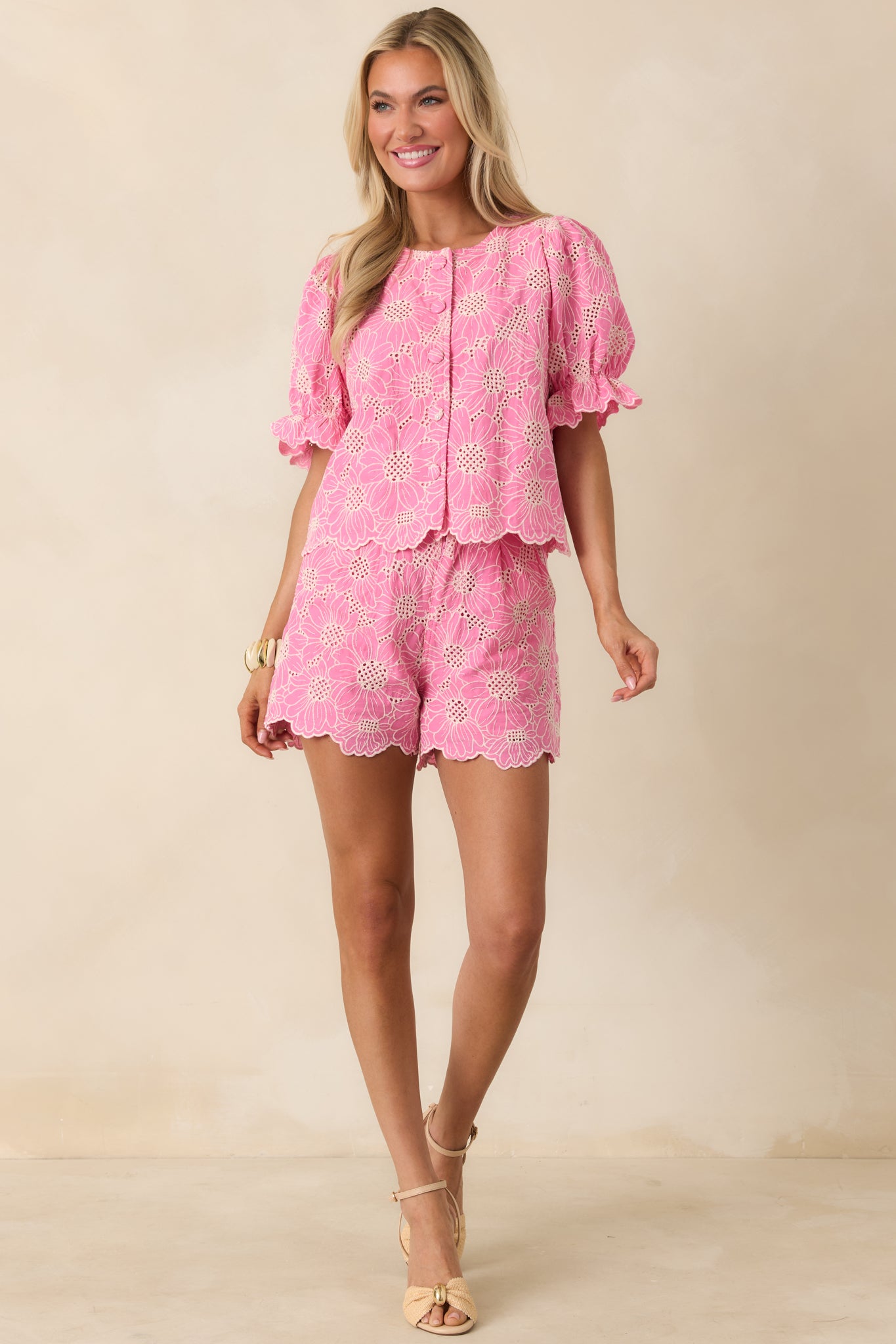 Feminine floral shorts with scalloped hem and relaxed everyday fit.