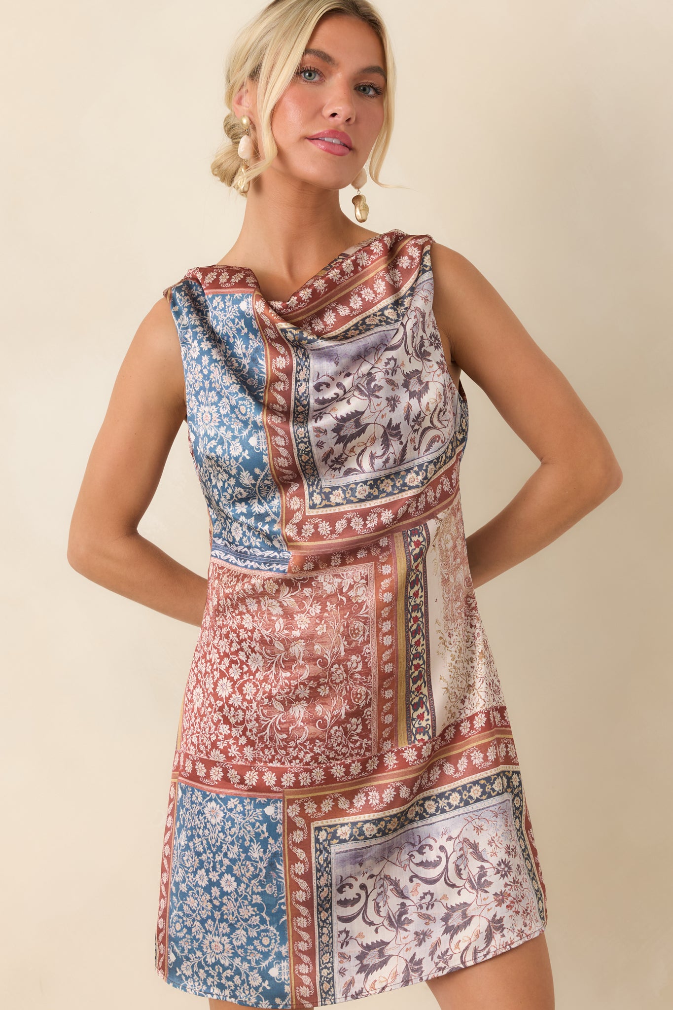 A fitted bodice transitions into a gently flared silhouette on this polished sleeveless dress.
