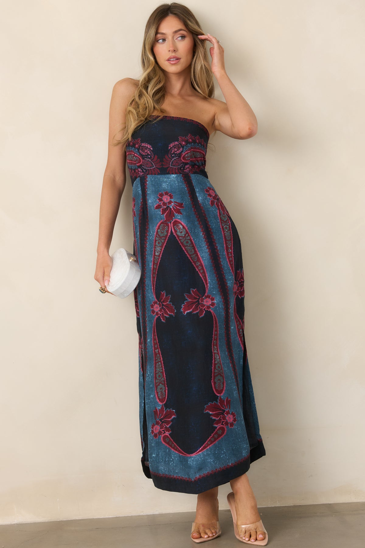 Fitted strapless dress with an ornate burgundy and rose floral print, contrasting navy and teal panels, and a softly flared skirt.
