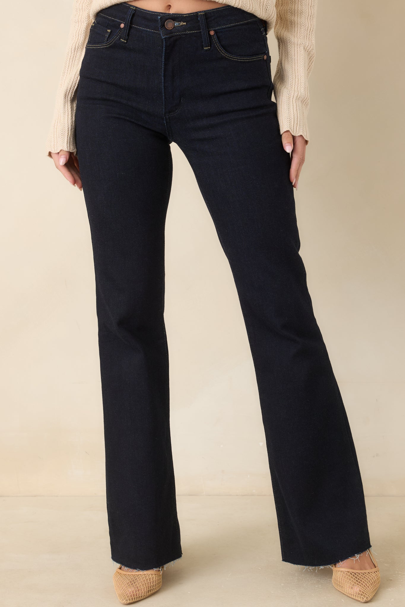 Classic five-pocket details and a button-and-zip closure define these stretch flare jeans.