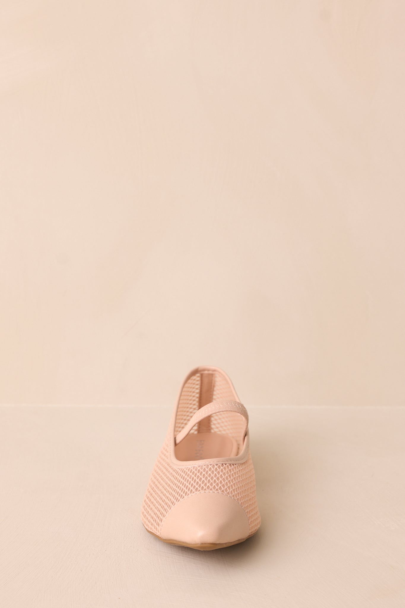 Top-down view of the flats emphasizing the elastic foot strap and cushioned sole.