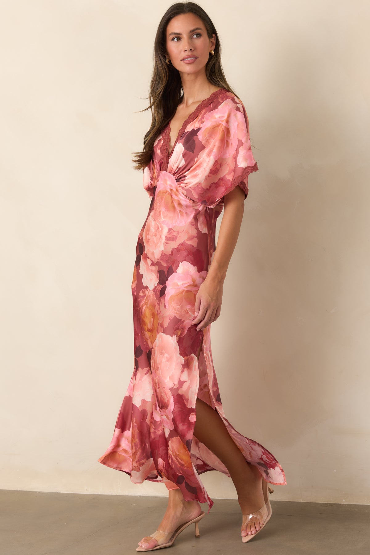 Floor-length floral dress showcasing the glossy satin fabric, flutter sleeves, delicate lace neckline, and flowing skirt.