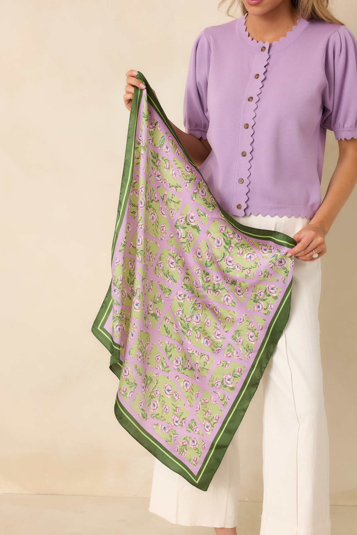 Floral and geometric patterned green scarf showing lavender blossoms over a lavender lattice design on a soft green background.