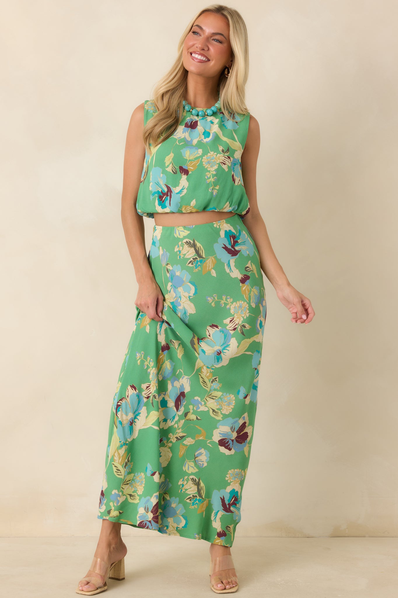 Lightweight bias-cut maxi skirt showcasing oversized floral blooms and a comfortable pull-on waistband.