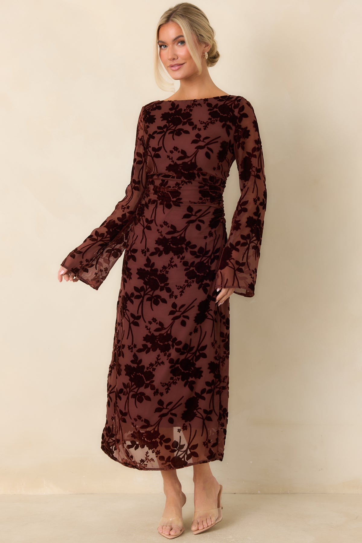 Floral burgundy dress with long sheer sleeves, a fitted bodice, and dimensional velvet detailing over mesh.