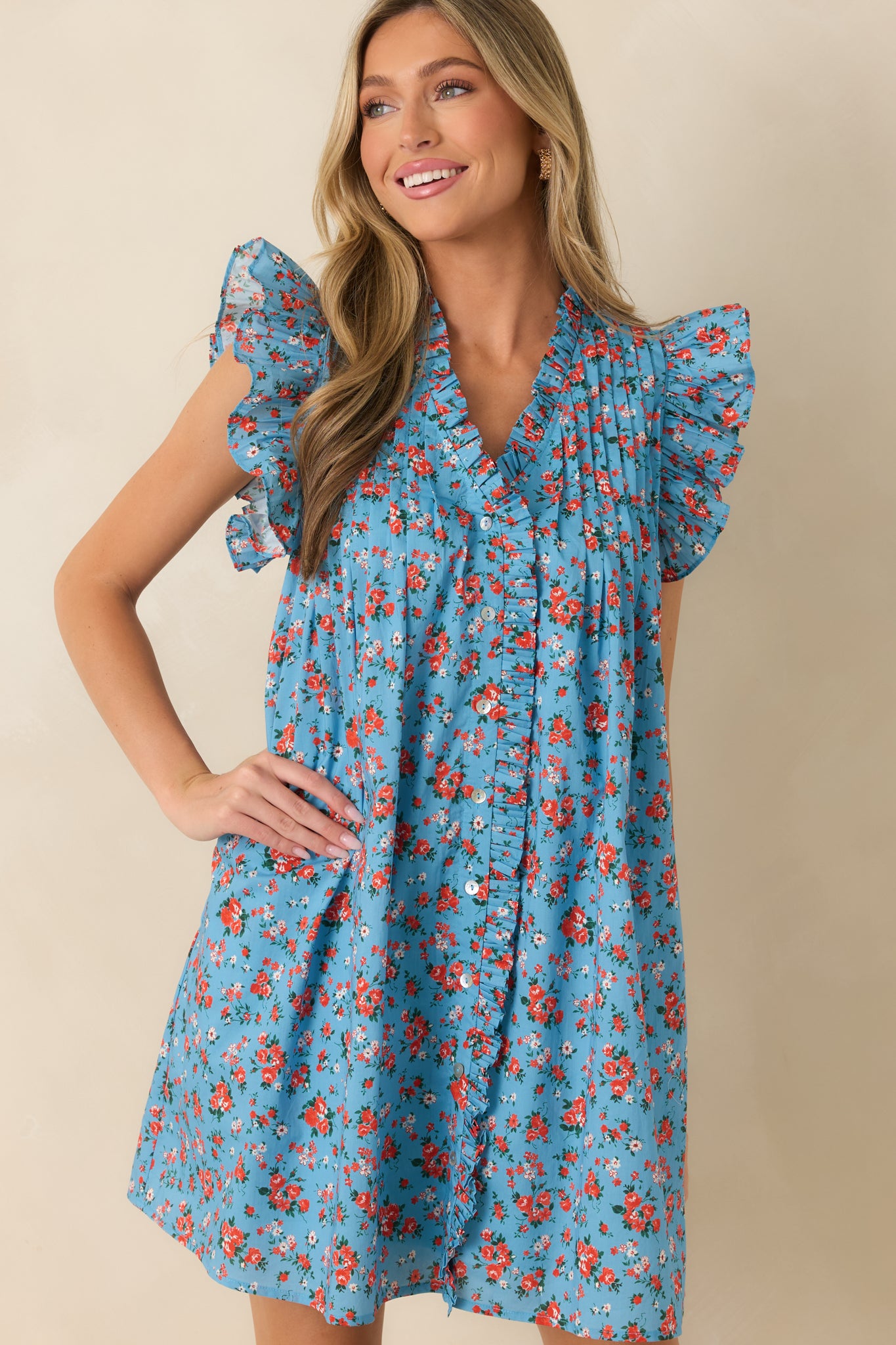 Functional front buttons enhance the soft floral design of this breathable cotton mini dress.
