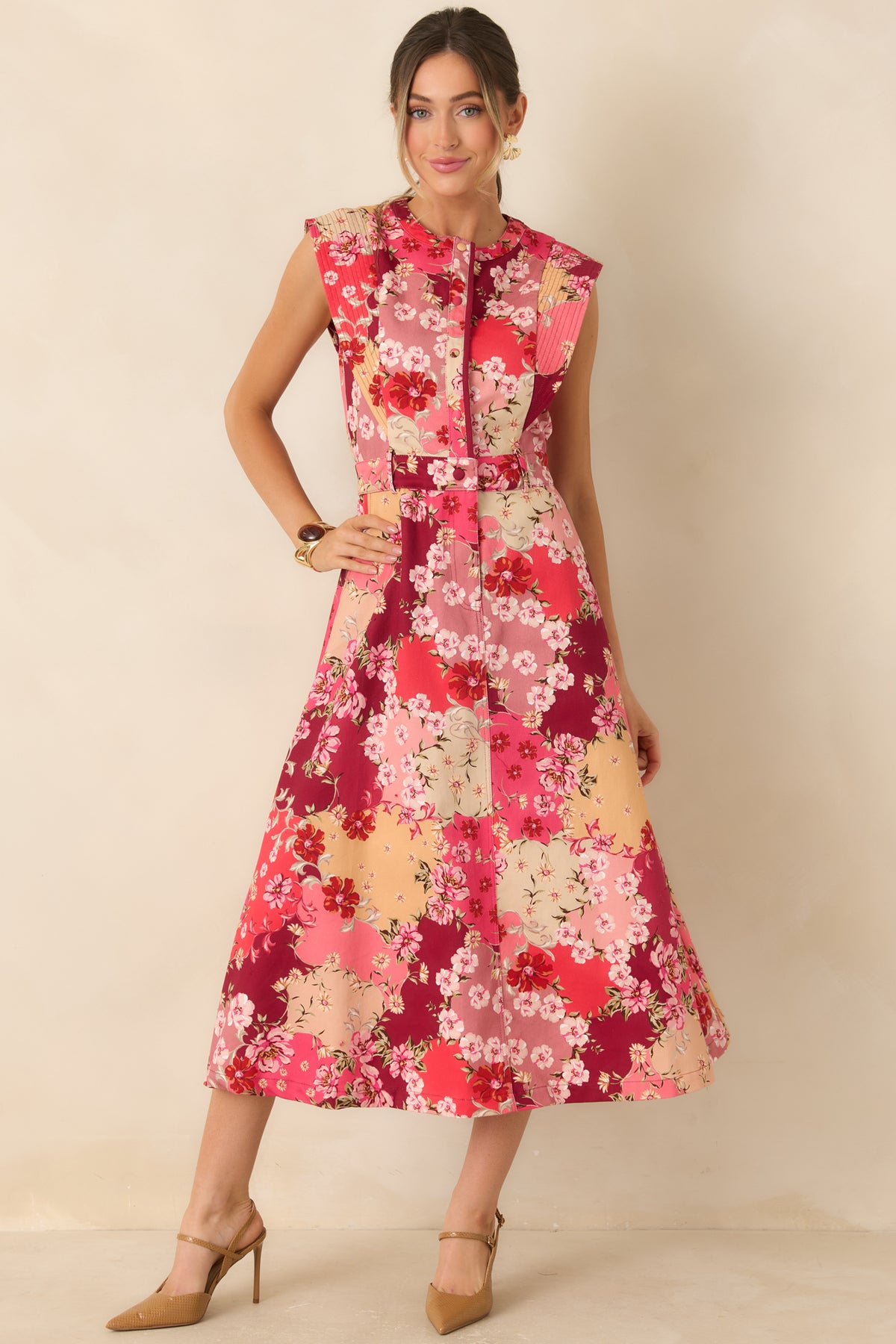 Floral cotton denim midi dress with pink, burgundy, peach, and cream blooms, a sleeveless bodice, and a flared skirt.