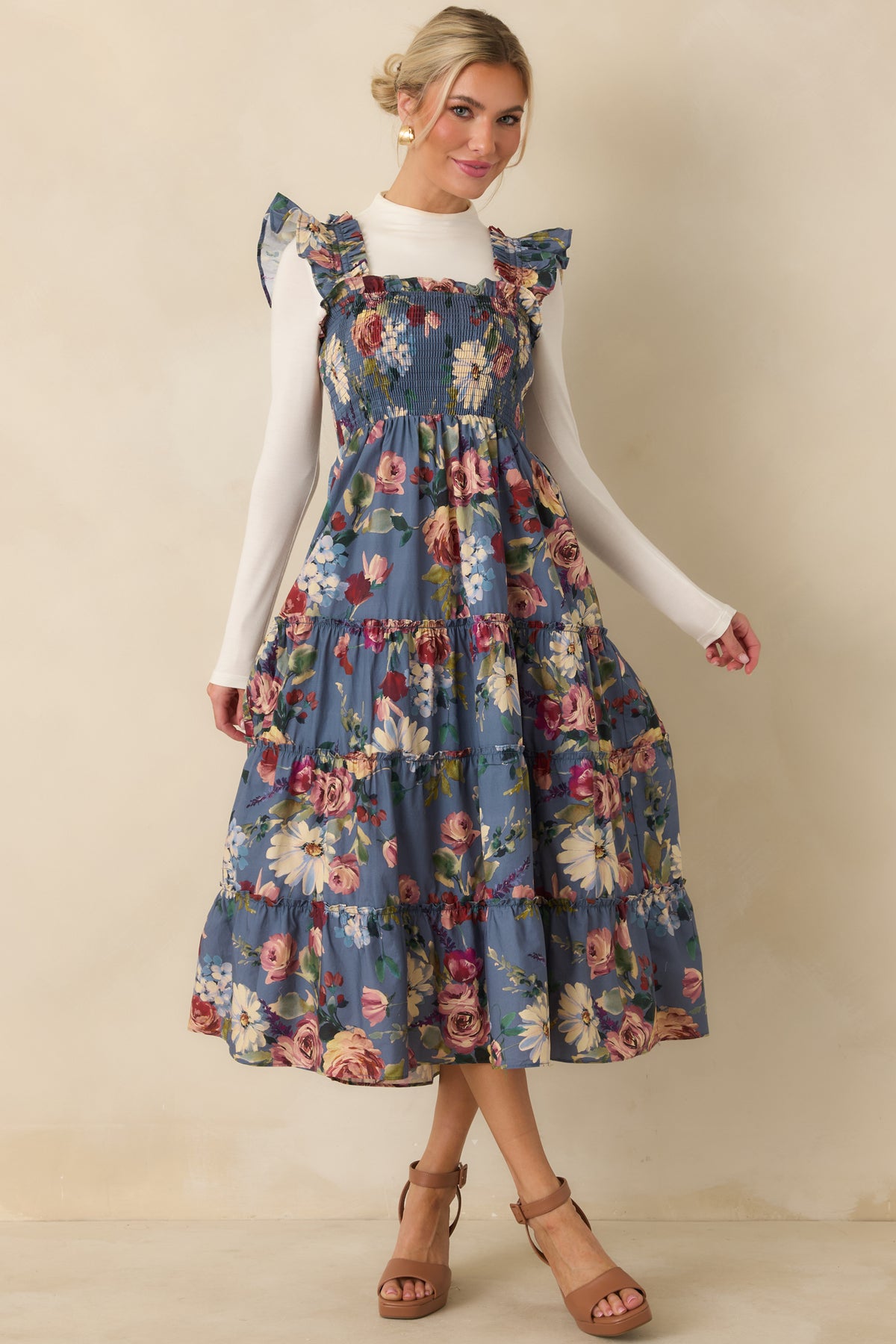 Floral cotton midi dress featuring fluttering ruffled straps, a fitted smocked bodice, and a full tiered skirt.