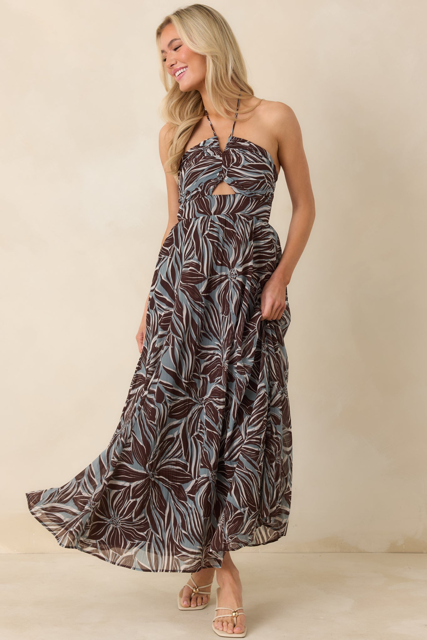 Halter floral maxi dress with fitted front, soft A-line skirt, and breathable woven fabric.