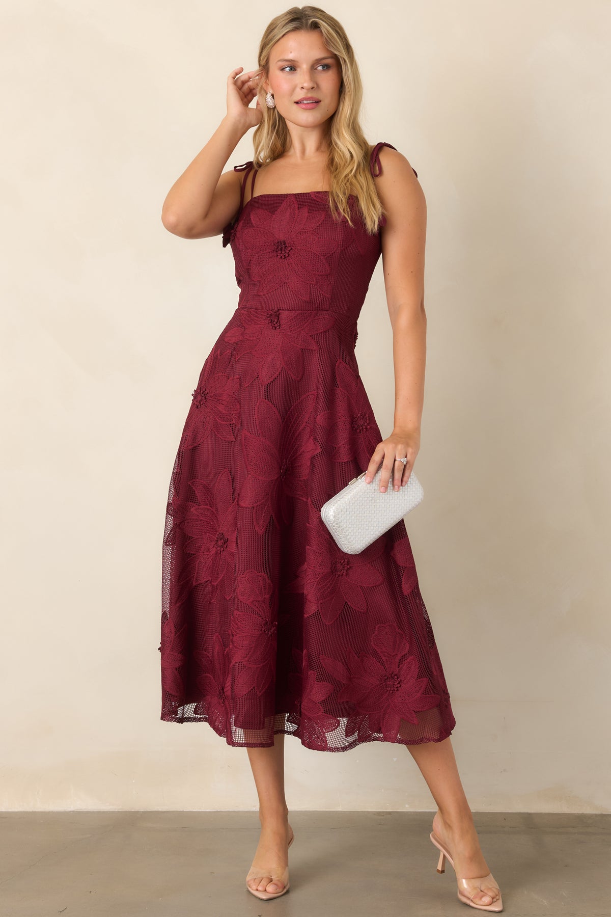 Floral lace dress highlighting the clean straight neckline and richly textured A-line skirt.