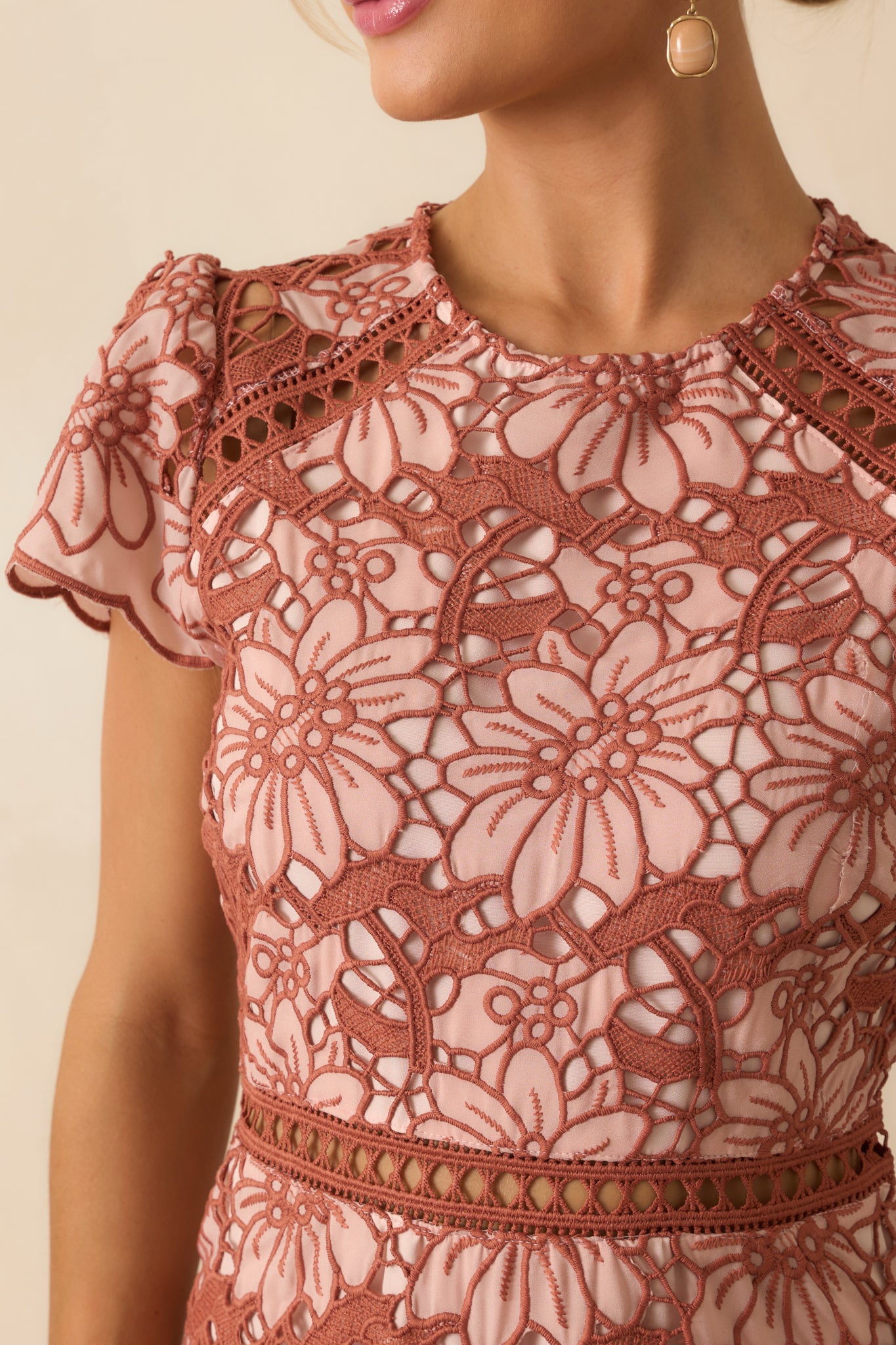 Detailed look at the intricate floral lace, scalloped edges, and sheer inset panels.