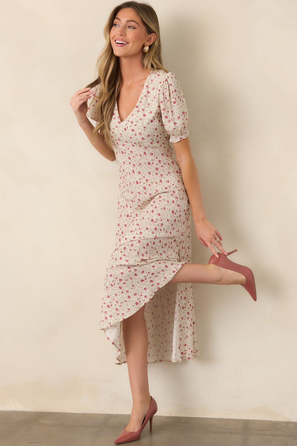Floral maxi dress showcasing voluminous puff sleeves with elastic cuffs, a defined elastic waist, and flowing floor-length silhouette.