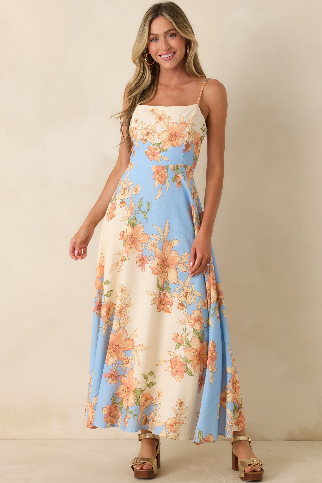 Floral color-block maxi dress showcasing a graceful floor-length silhouette with soft vintage-inspired floral detailing.