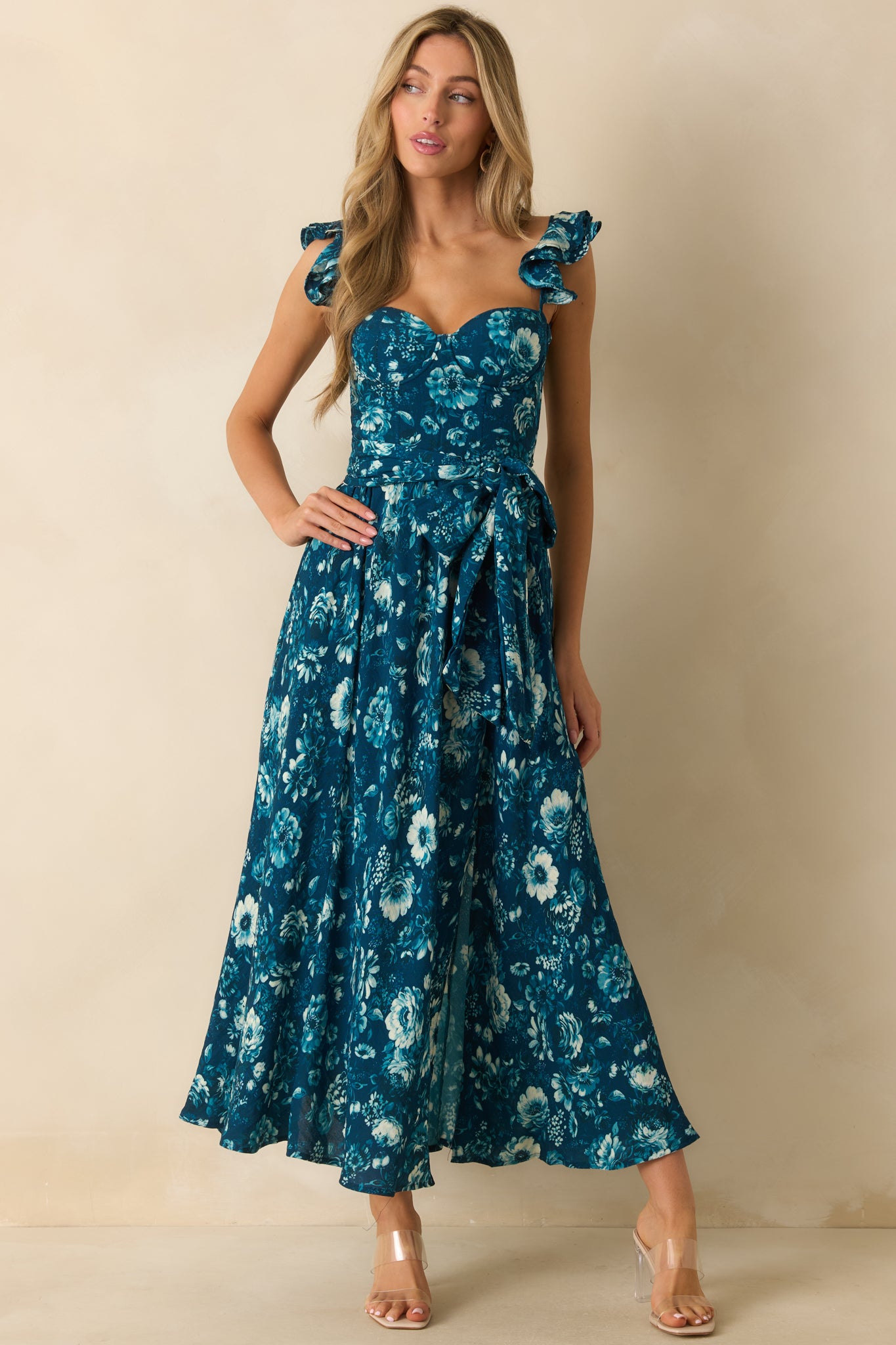 Floral maxi dress featuring padded underwire bustier, adjustable ruffle sleeve straps, and a flowing full-length skirt.