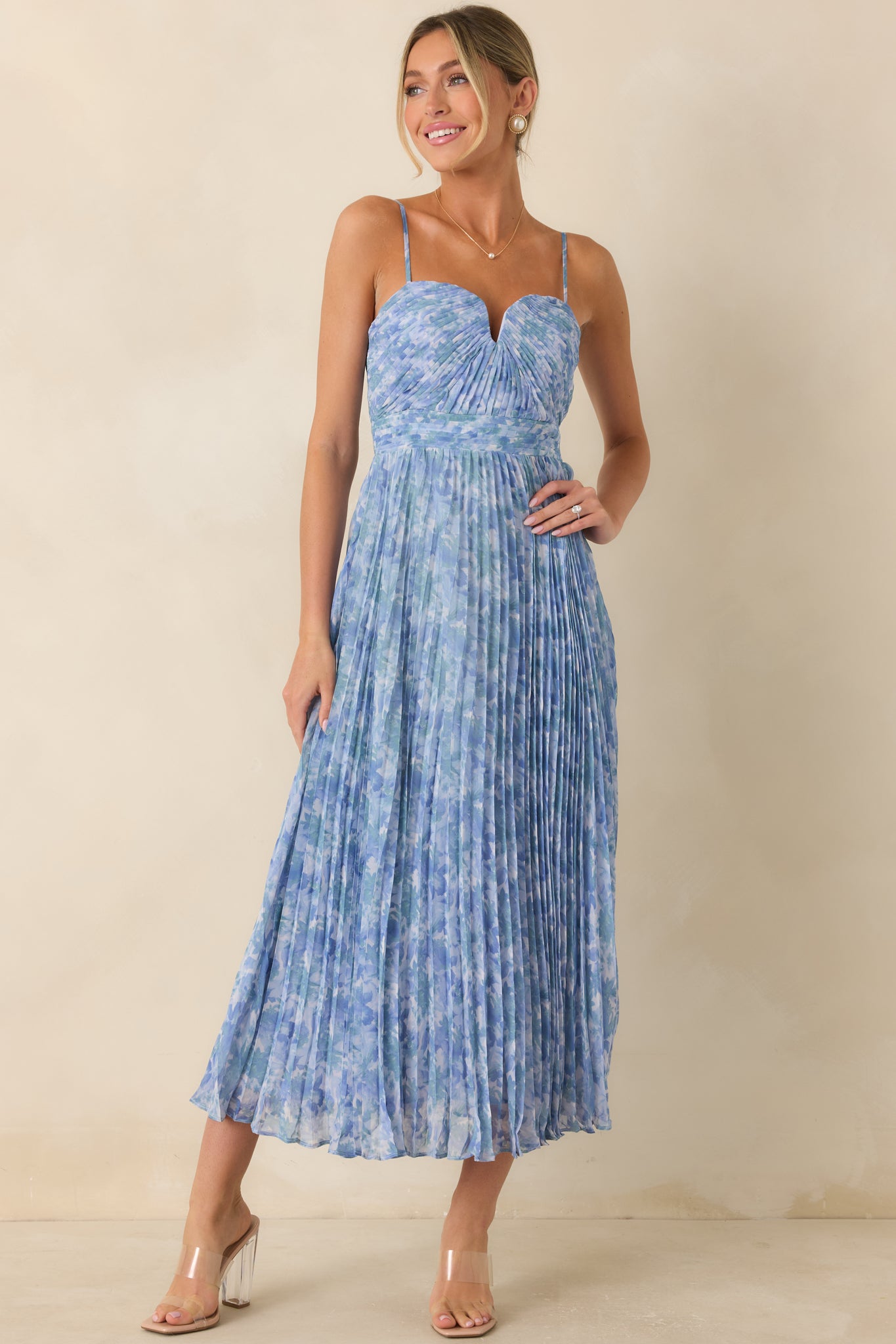Floral maxi dress designed with delicate pleating, front boning, and a flattering sweetheart neckline.
