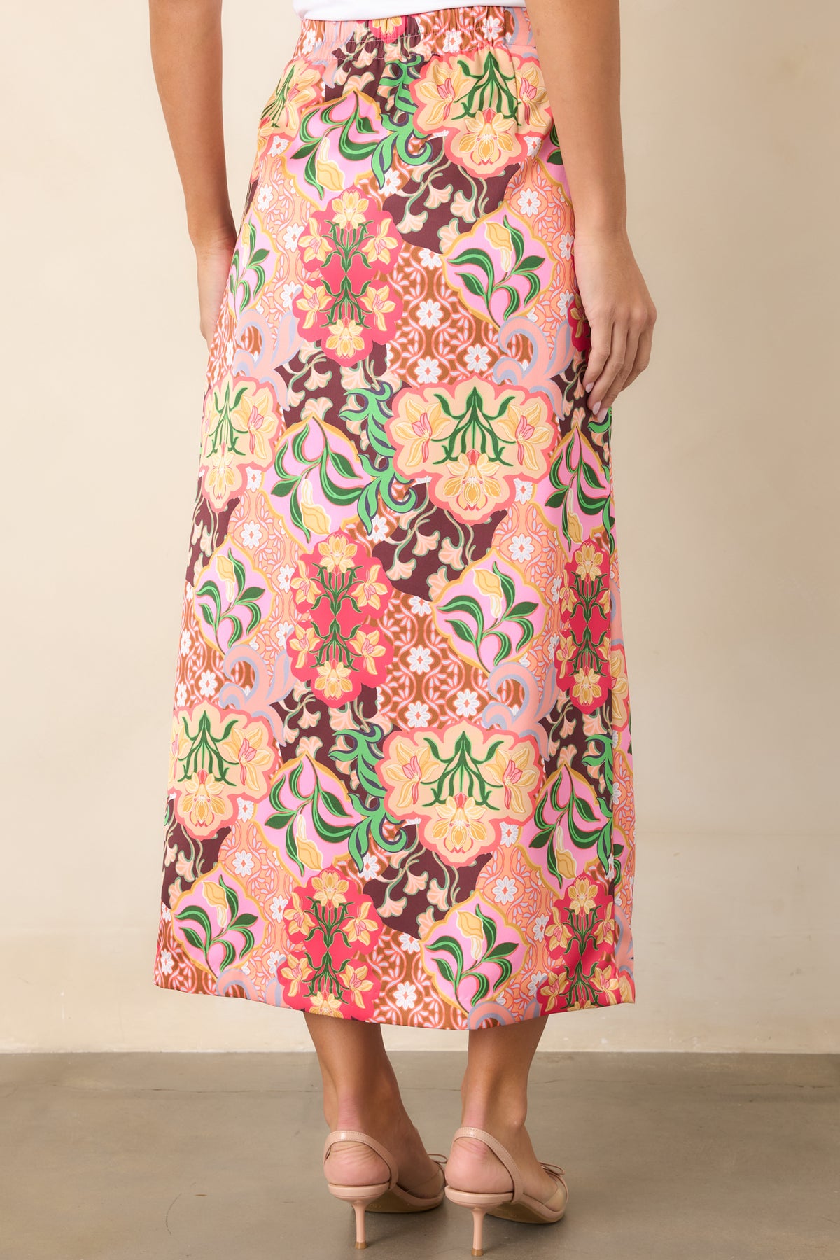 Rear of the floral medallion midi skirt showing the elasticized back waistband and gently flared silhouette.
