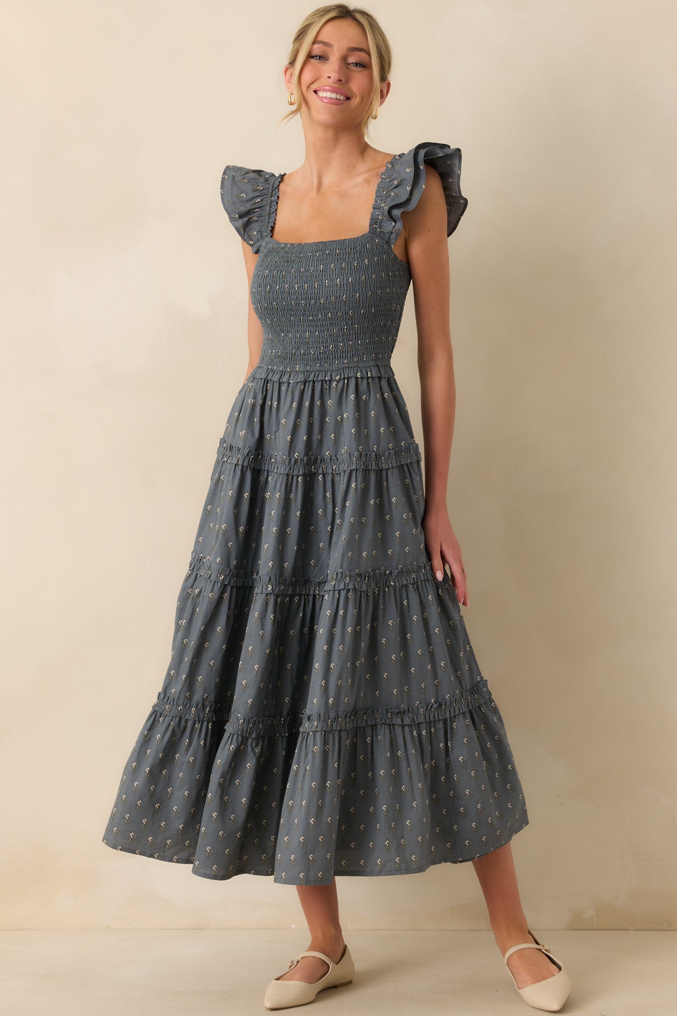 Floral print midi dress with elastic straps and softly layered ruffle hem.