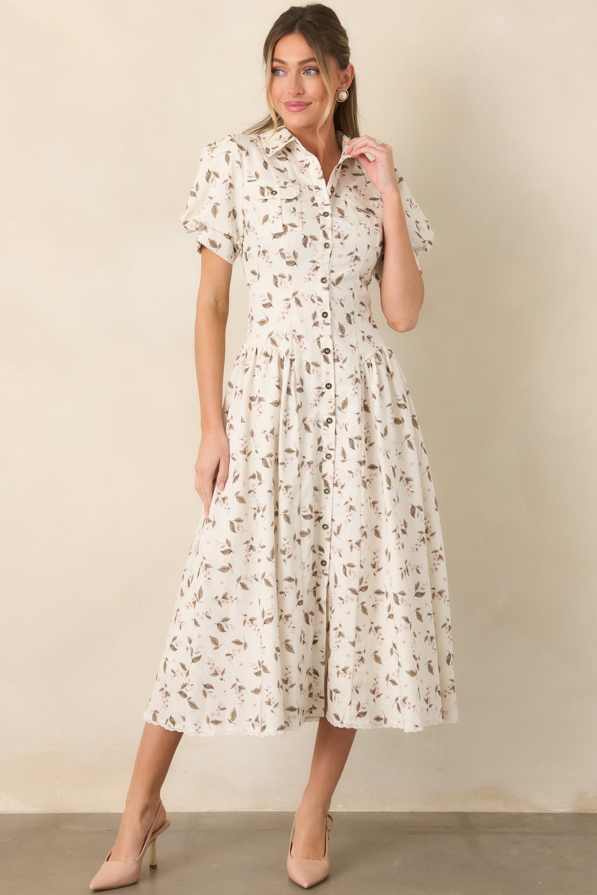 Gathered midi skirt flows from the shaped waist, finished with a delicate lace-trimmed hem and cotton lining.