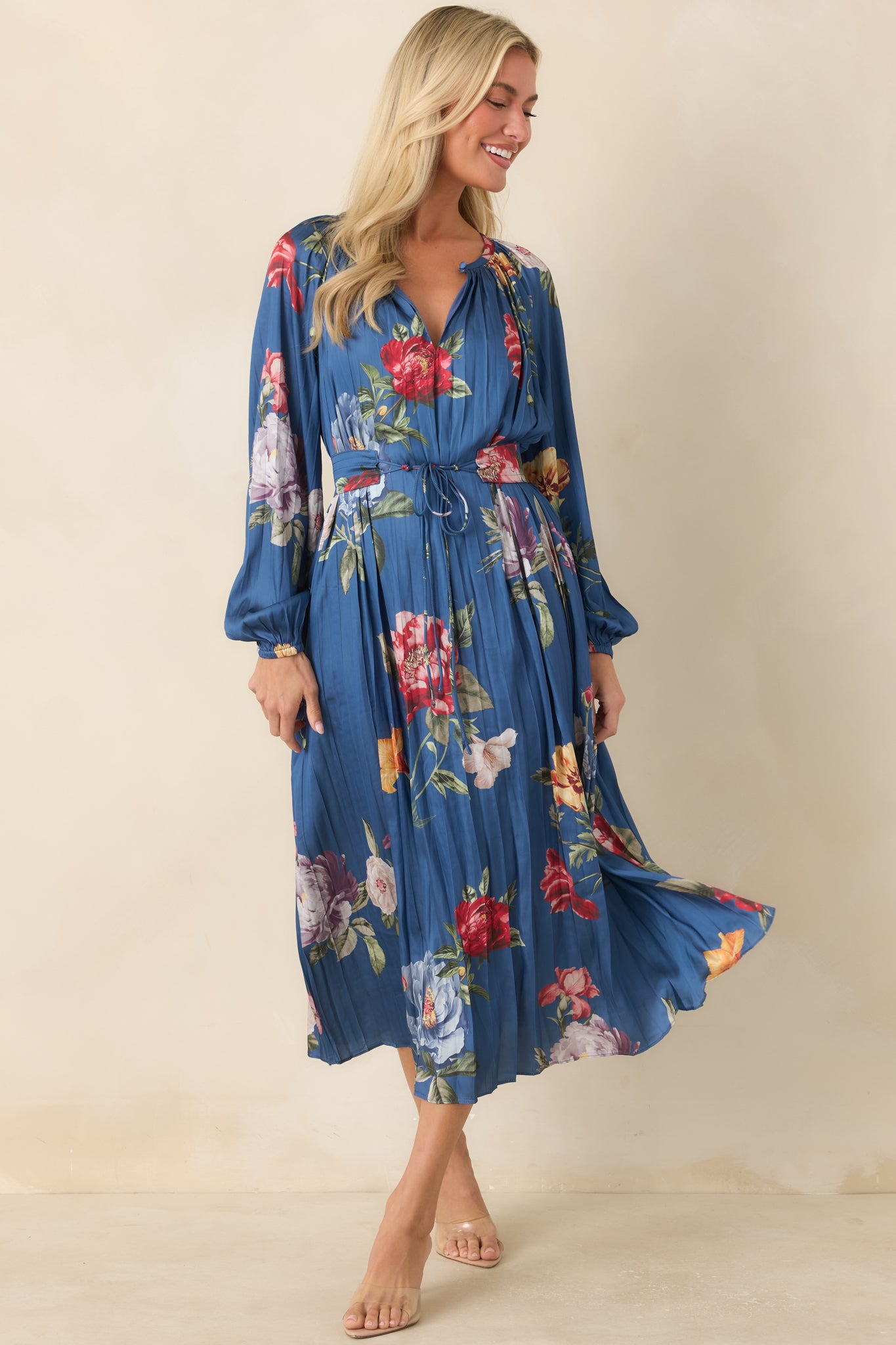 Floral midi dress with soft all-over pleating, long balloon sleeves, and a defined waistband with a removable tie belt.