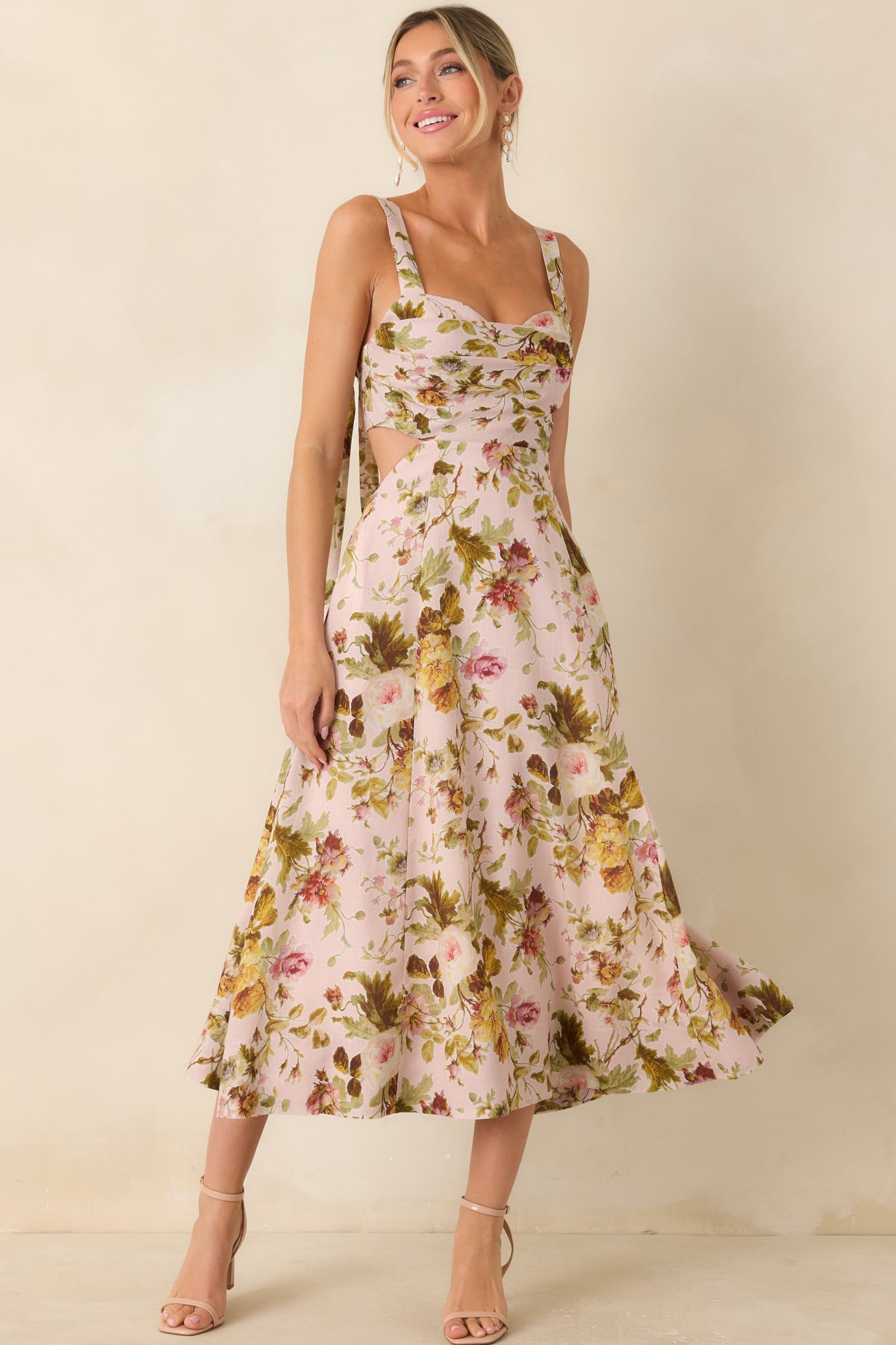 Floral print midi dress featuring a pleated sweetheart bodice and graceful skirt with hidden side pockets.