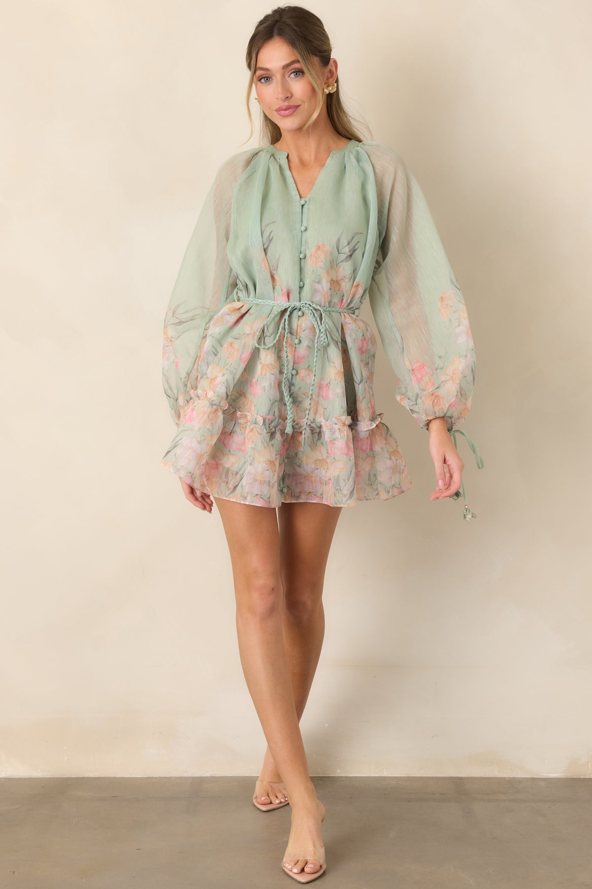 Floral mini dress showcasing sheer balloon sleeves and a removable braided waist belt.