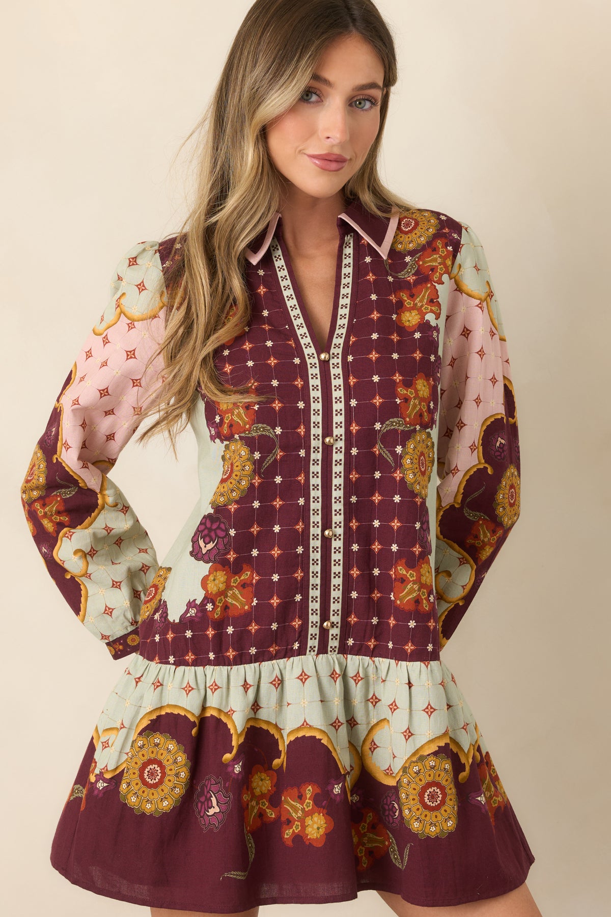 Floral mini dress featuring voluminous blouson sleeves gathered into narrow cuffs.