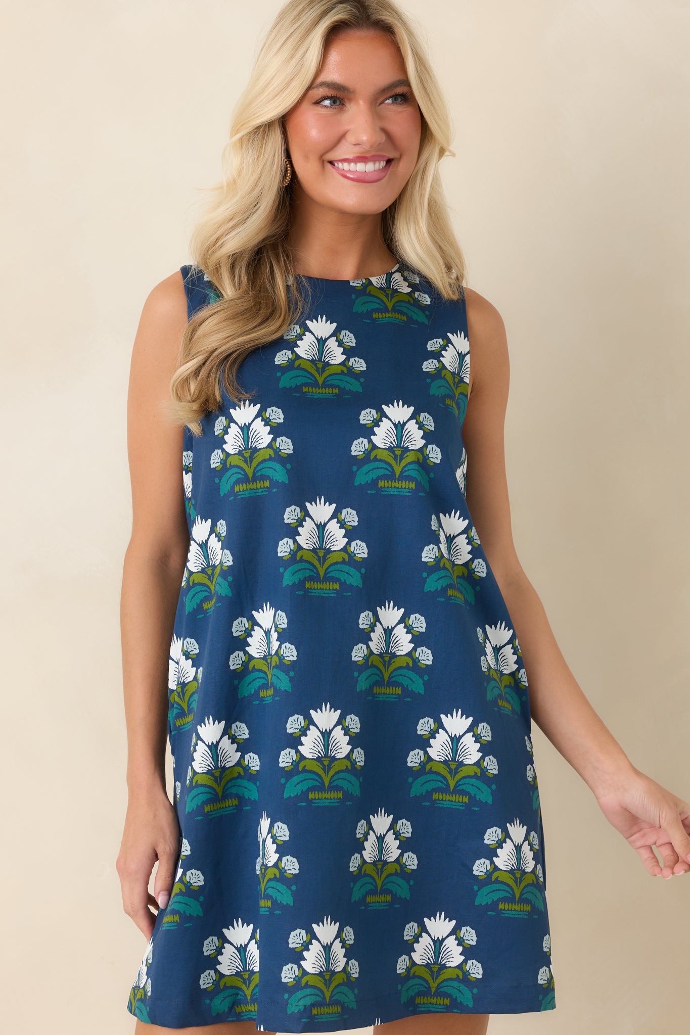 The front of this floral mini dress highlights the crisp white flowers and colorful accents.