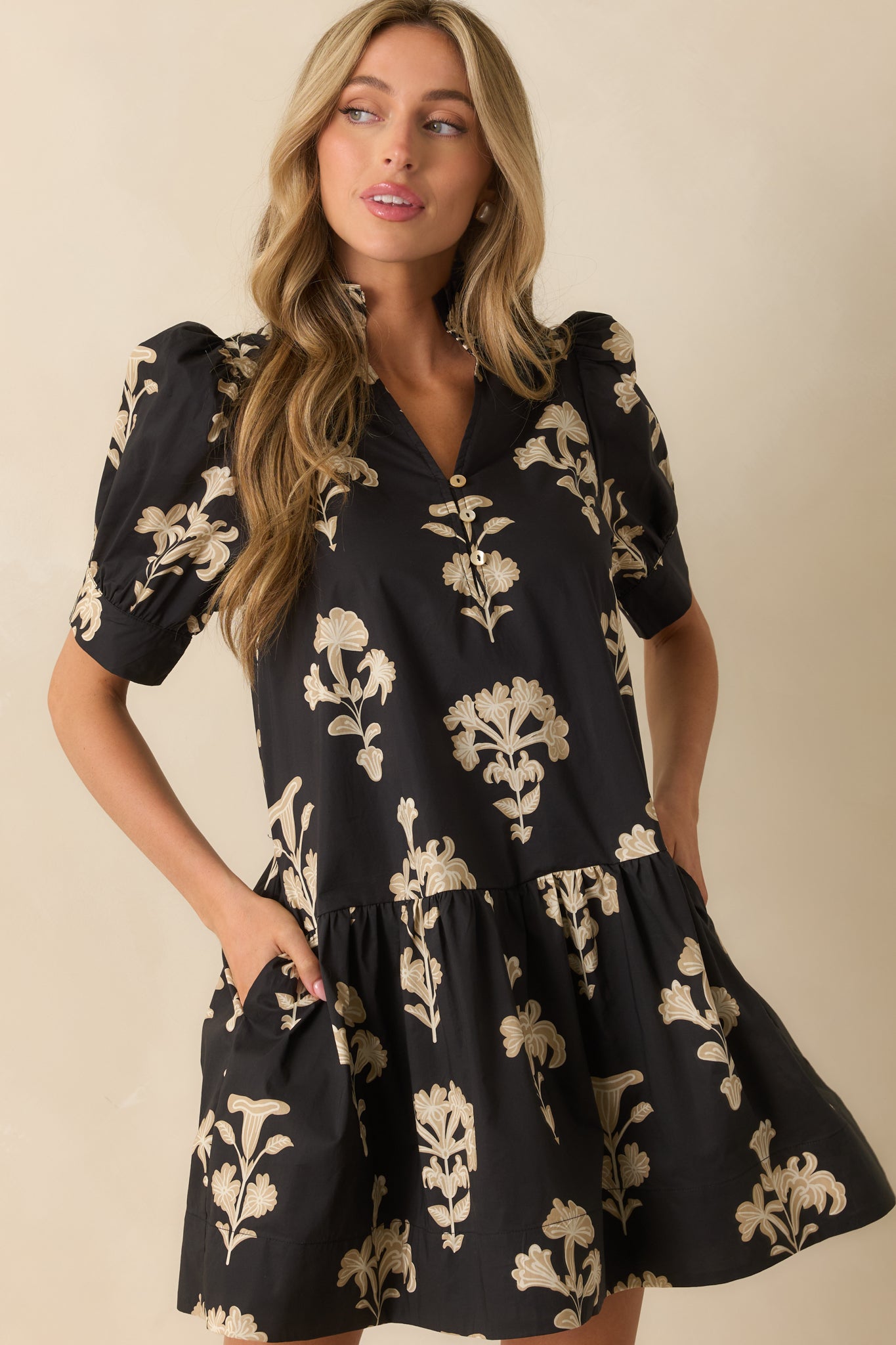 Front close-up showing the floral print and relaxed silhouette across the chest and shoulders.