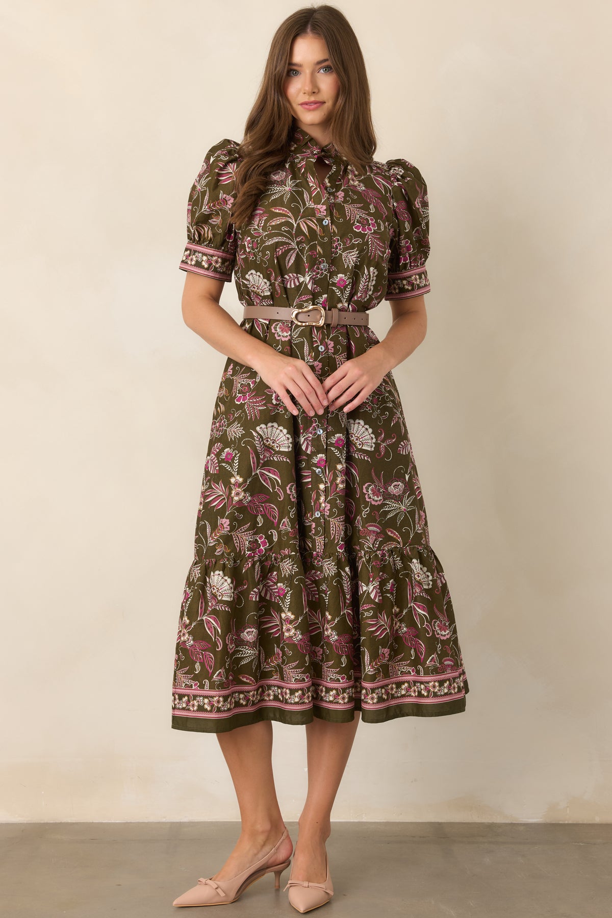 Floral print dress accented with soft pink, ivory, and neutral tones throughout.
