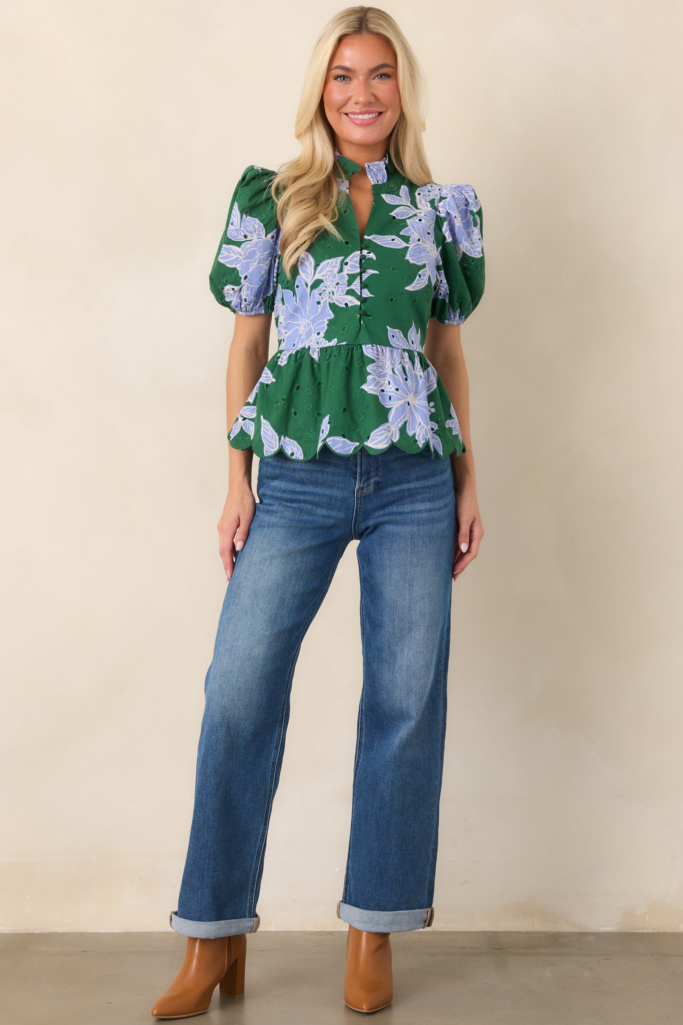 Feminine floral-print top with a structured ruffle collar, delicate embroidery, puffed sleeves, and a softly finished scalloped hem.